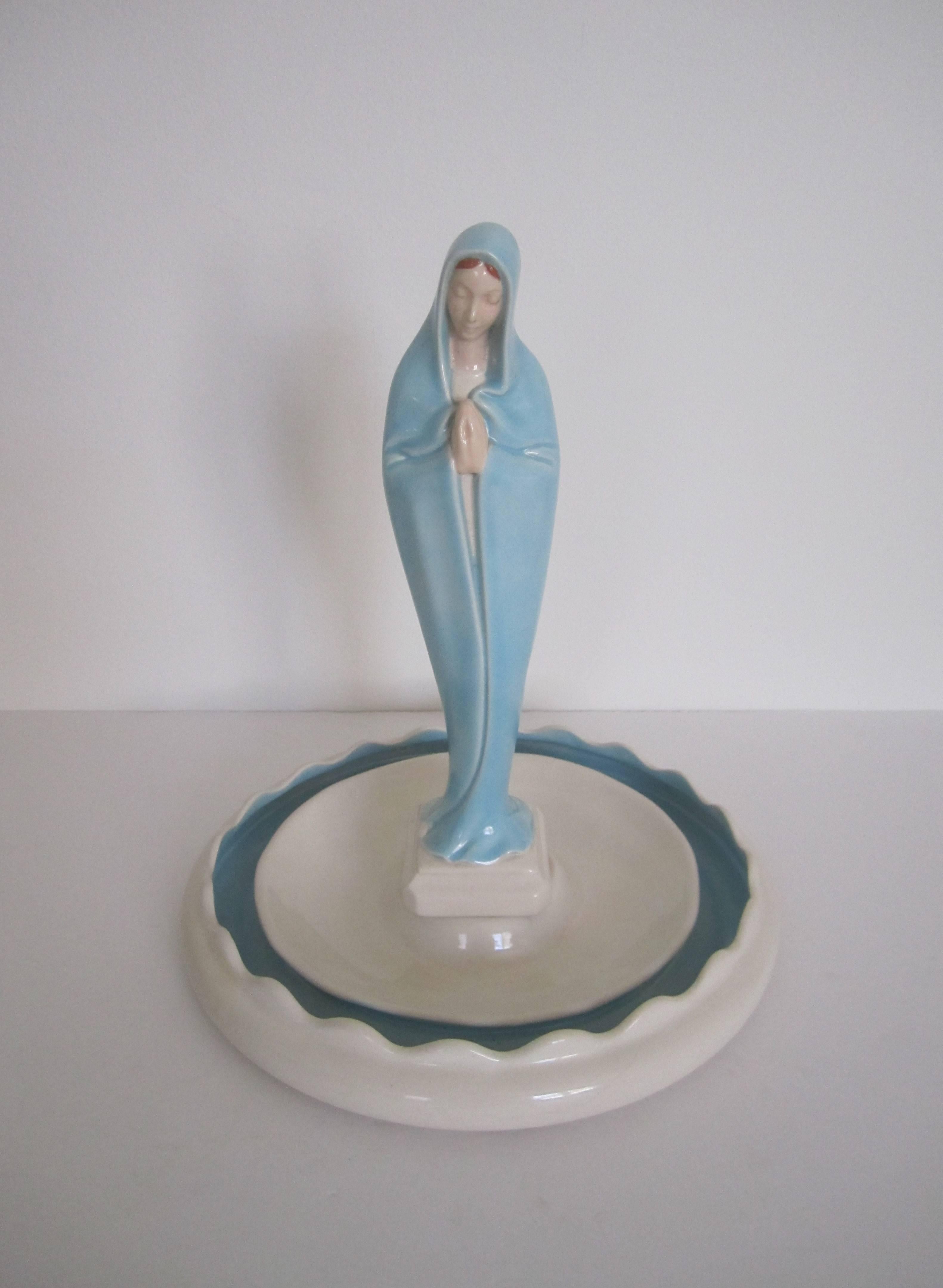 A beautiful vintage Mother Mary sculpture in traditional white and light blue in standing prayer position. Mother Mary Roman Catholic sculpture vessel is designed to hold 'Holy Water' in area just below her feet, and fresh water and small flowers or