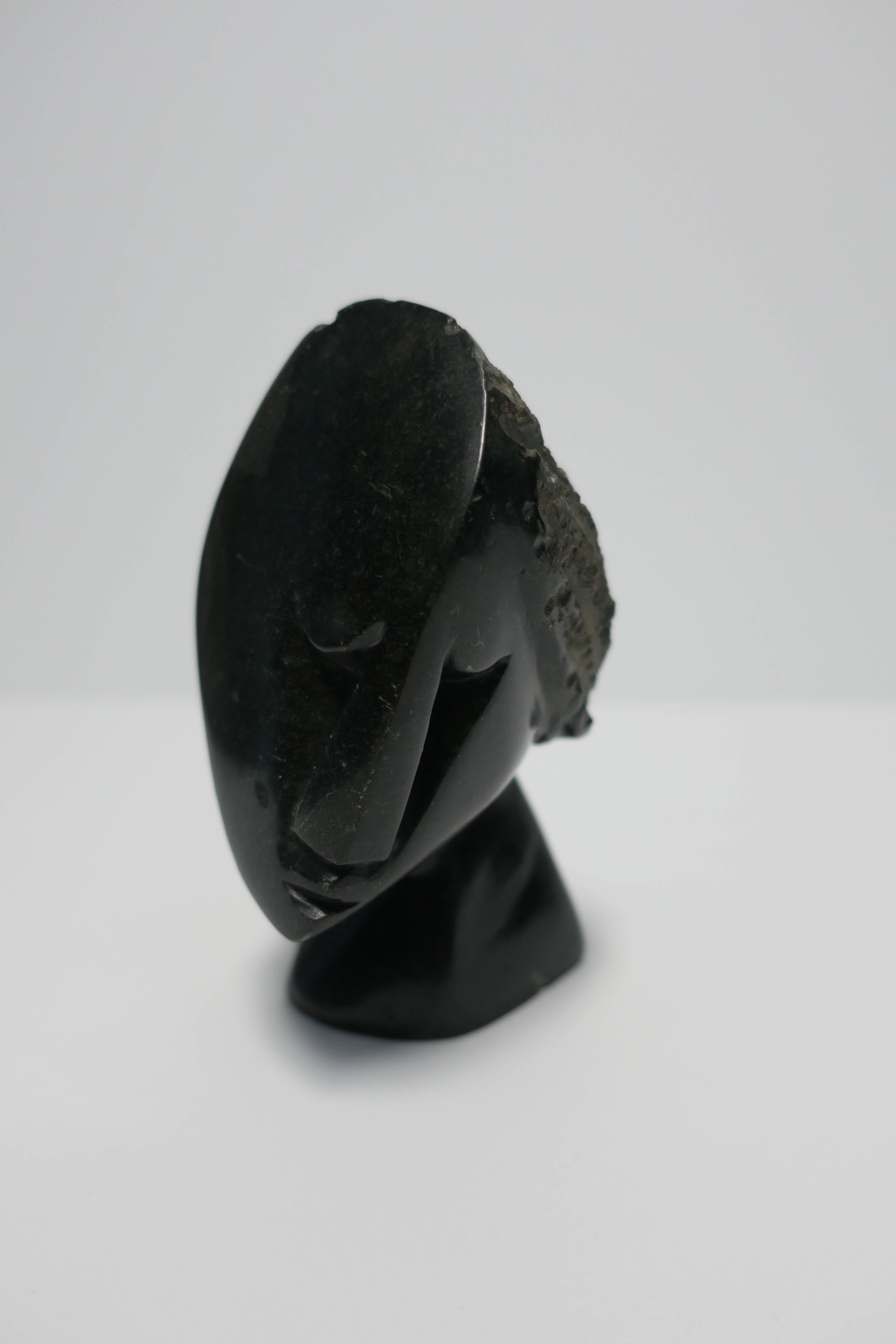 A small vintage hand-carved black marble or stone Cubist sculpture after Picasso. Black in color and carved out of a single piece of stone. 

Sculpture measures 5 in. H 

Item available here online. By request, item can be made available by