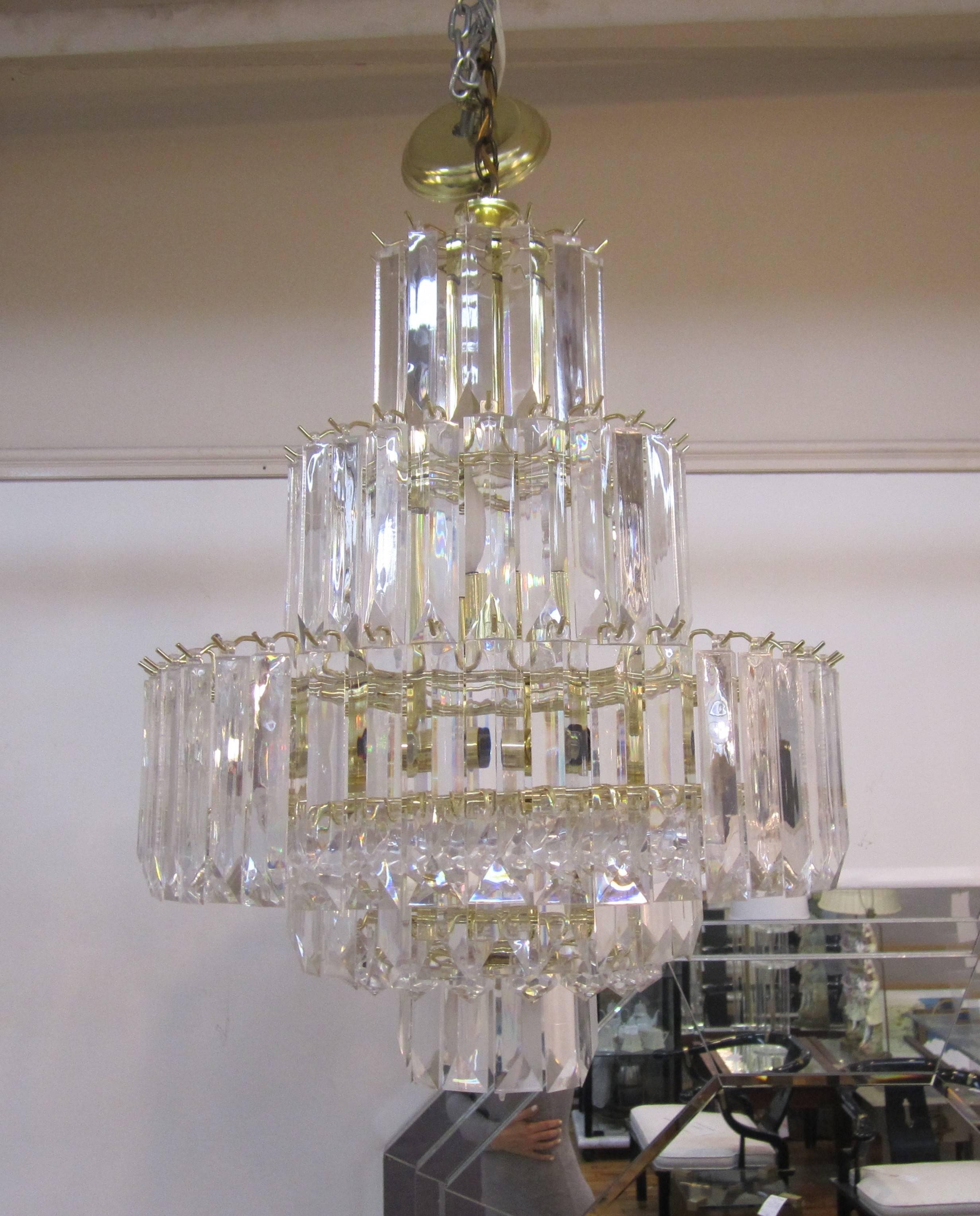 A beautiful seven-tier, nine-light, vintage Modern Lucite 'Wedding Cake' chandelier in the style of designer Charles Hollis Jones. A great alternative to crystal without the weight or cost, circa 1960s - 1970s Modern. 

Measurements: 
26