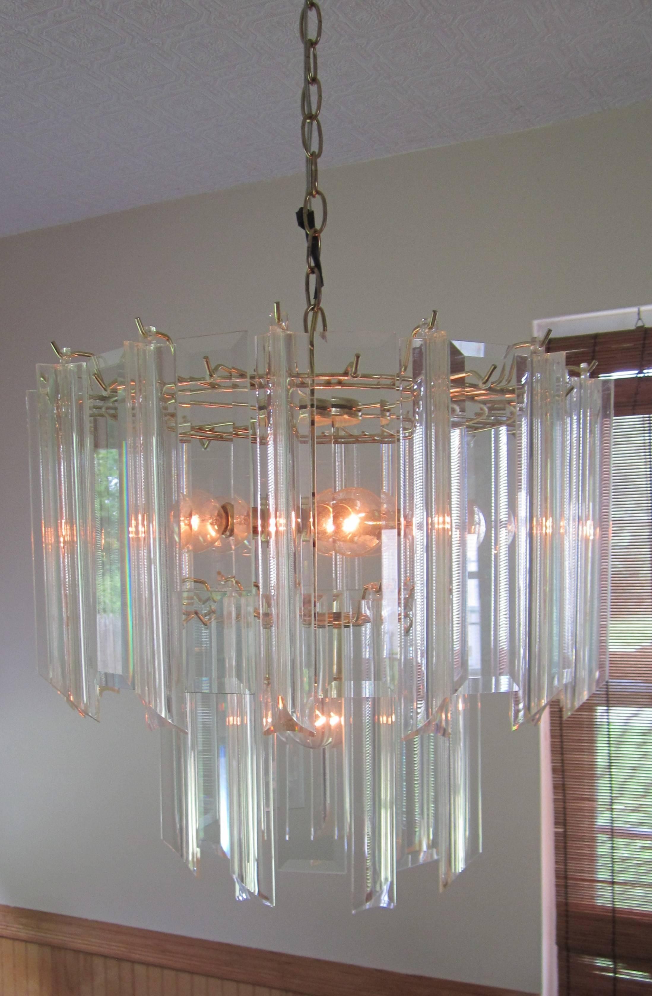 A '70s Lucite/acrylic and crystal combination, six-light, two-tier, chandelier on a brass plated metal frame. Chandelier is in the style of designer Charles Hollis Jones, circa 1960-1970s. 

Gold giltwood 'bamboo' mirror shown in image #6 also