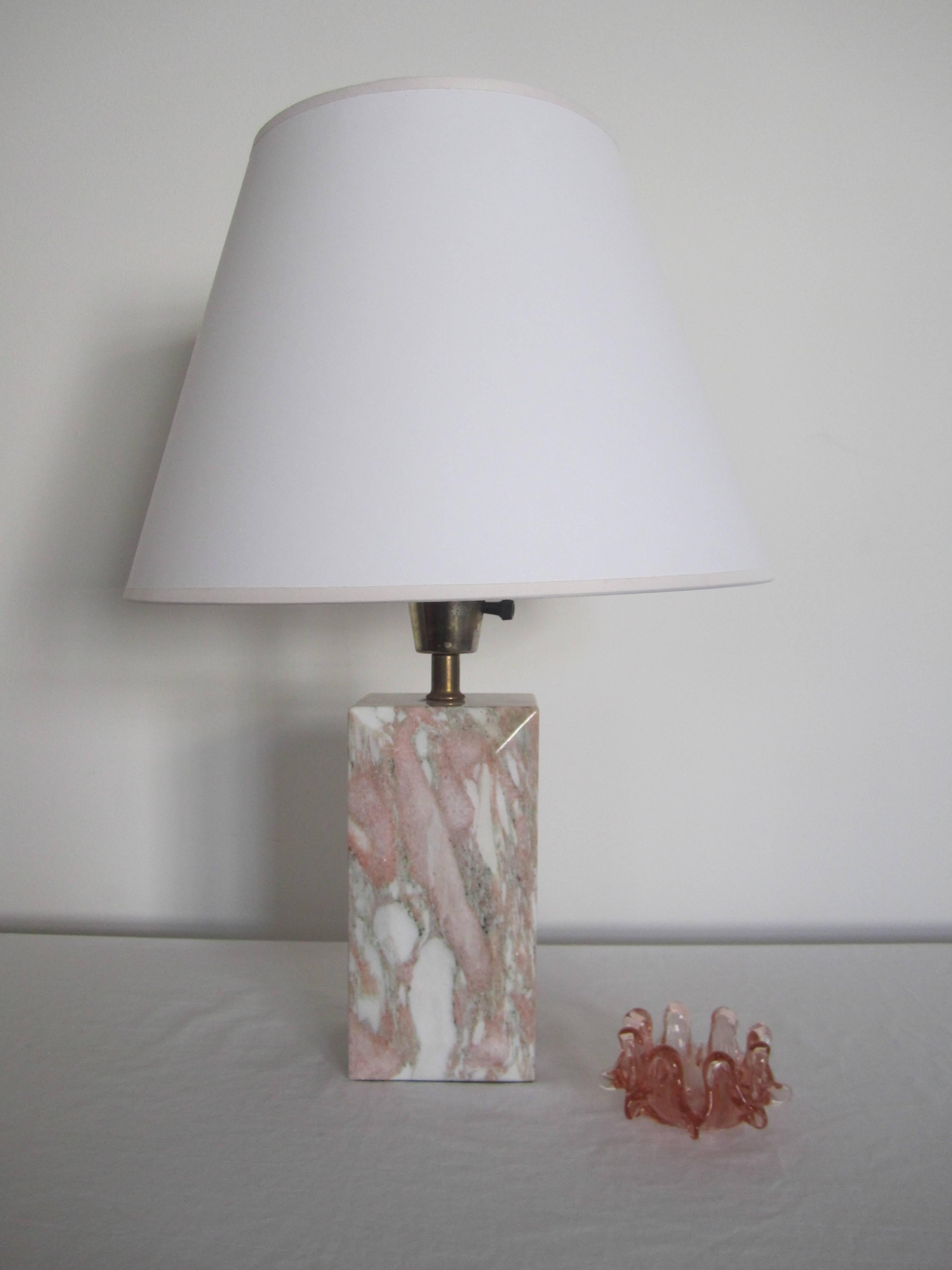 A beautiful and substantial '70s Modern or early Post-Modern period marble table or desk lamp, circa 1970s. Marble is polished, rectangular in shape, and has an 'emerald cut' detail on front and back. Marble has shades of white, pink, grey, and a