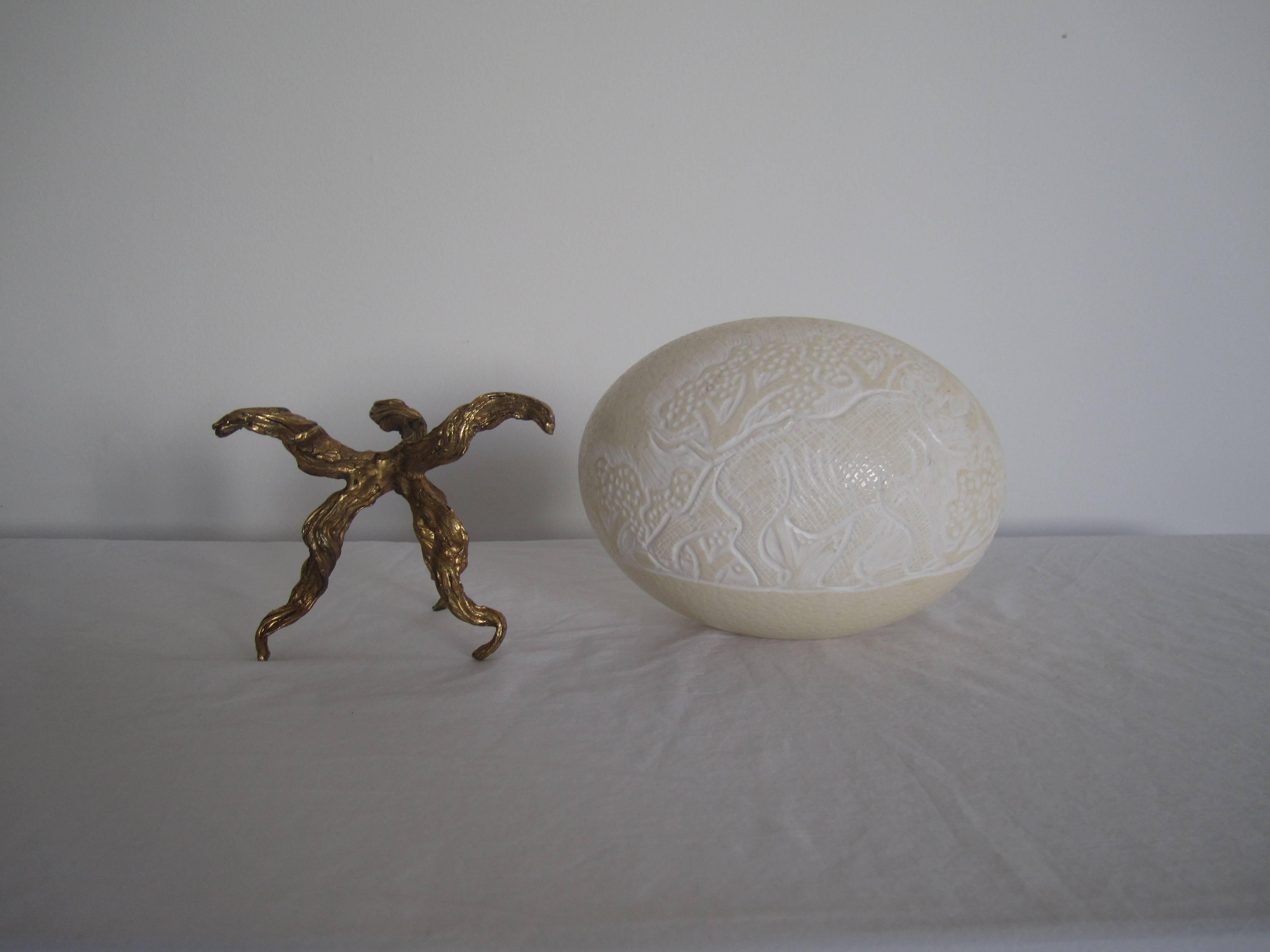 Carved Elephant and Rhino Craved Ostrich Egg on Twisted Gold Base