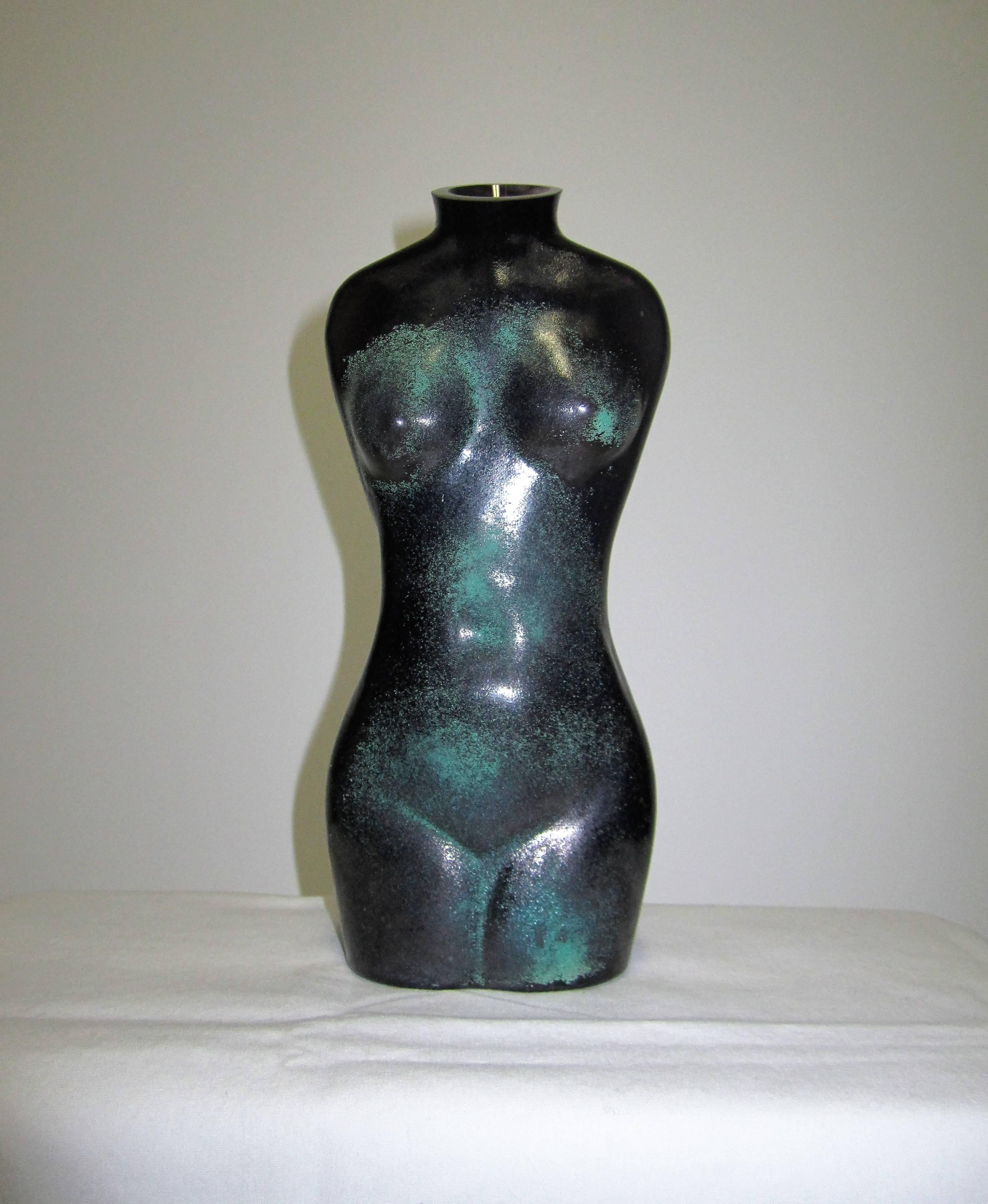 A Scandinavian black glass modernist female nude torso sculpture vessel or vase by Renate Stock for Kosta Boda, with a matte green sand-like texture. Made in Sweden, with maker's mark on bottom. 

Measuring 9 in. H 

Item available here online. By