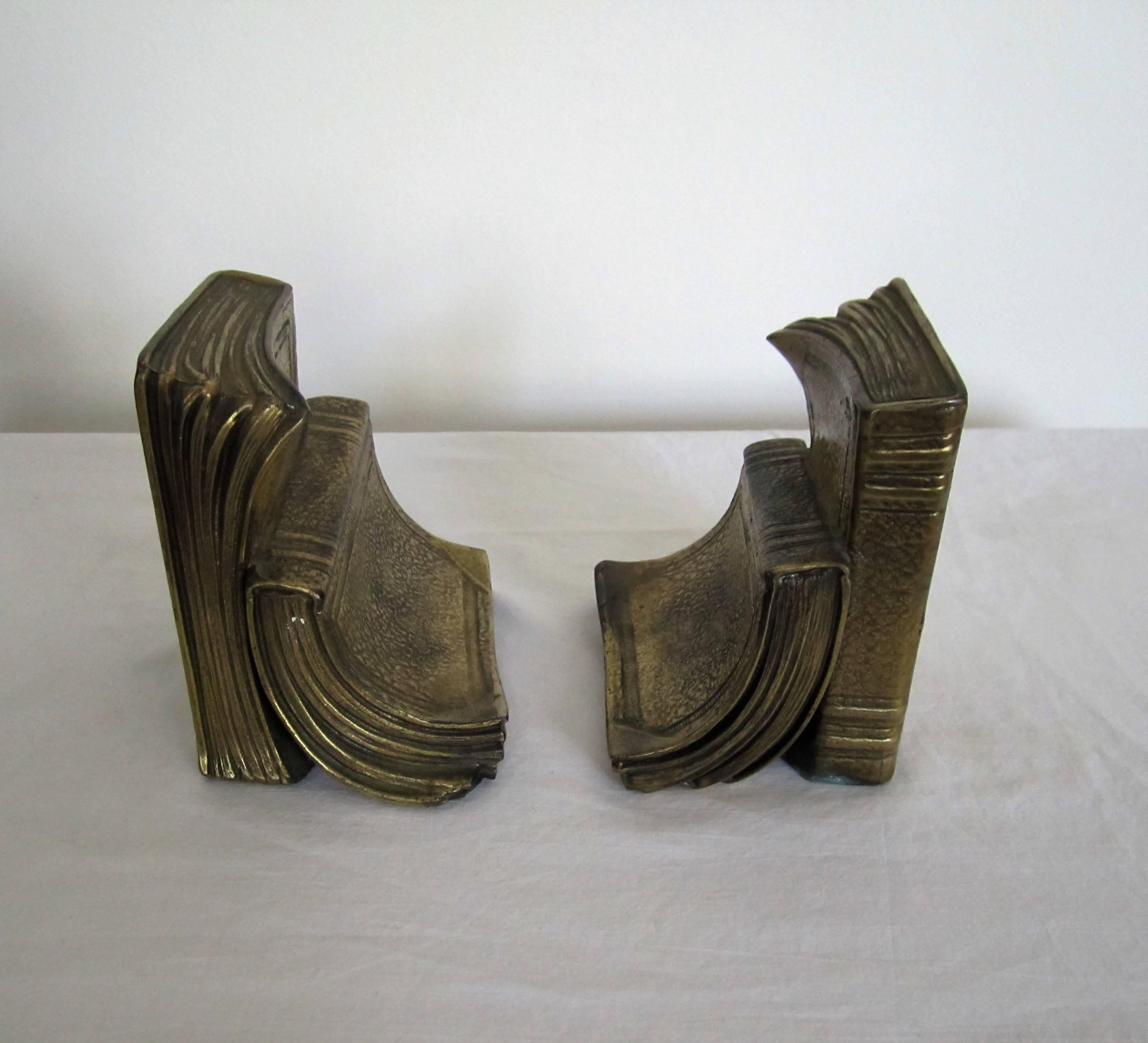 Pair/Set Available here for $95 on Sale.

A pair of vintage 'book' bookends in a brass plated metal. With maker's mark and marked 'Made in USA' as show in images. Each 4.5 in. H. 