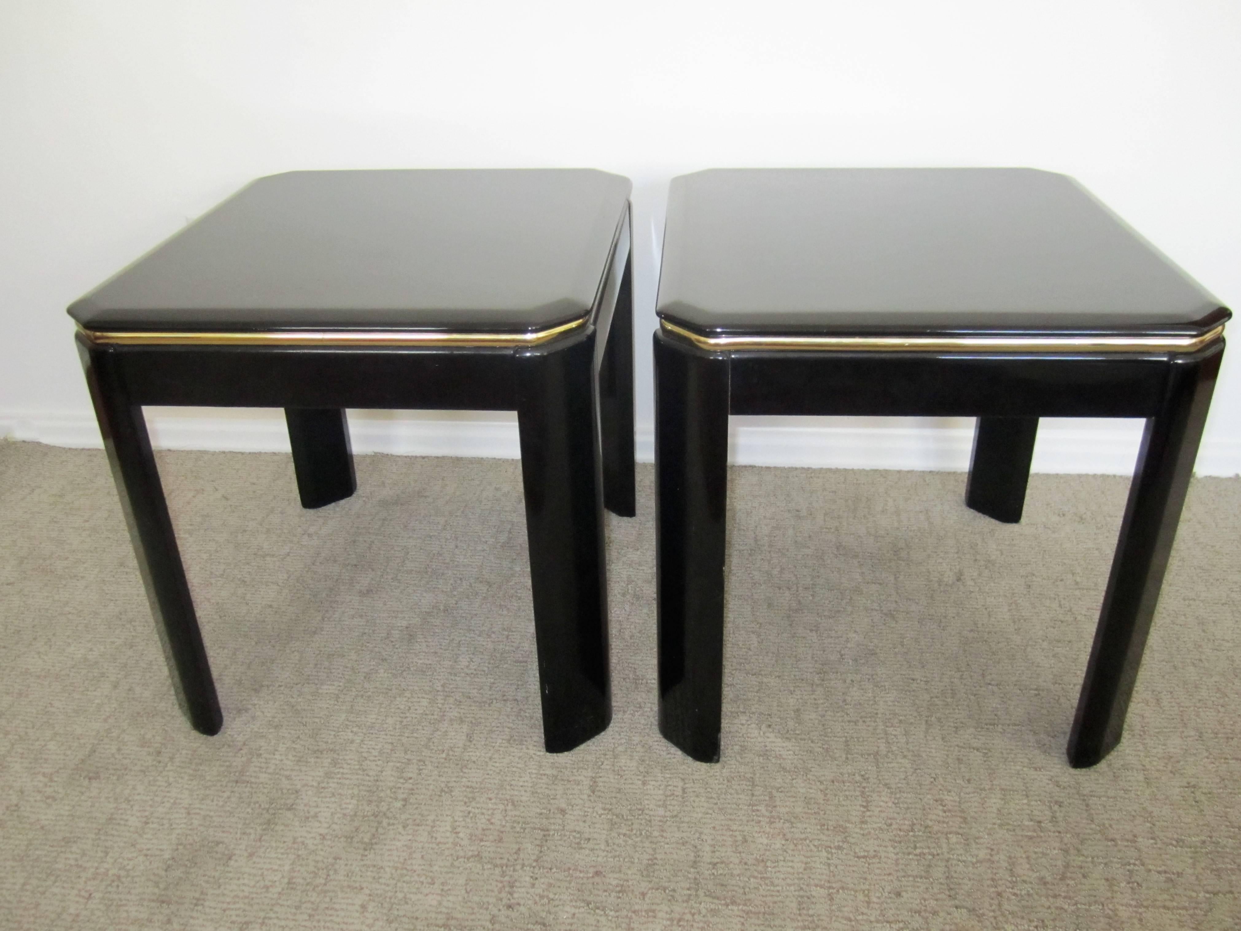 A pair of vintage post-modern square black lacquer and brass end tables or nightstand tables with tapered corners. Pair available here online. By request, pair can be made available by appointment to the Trade (in New York.) 