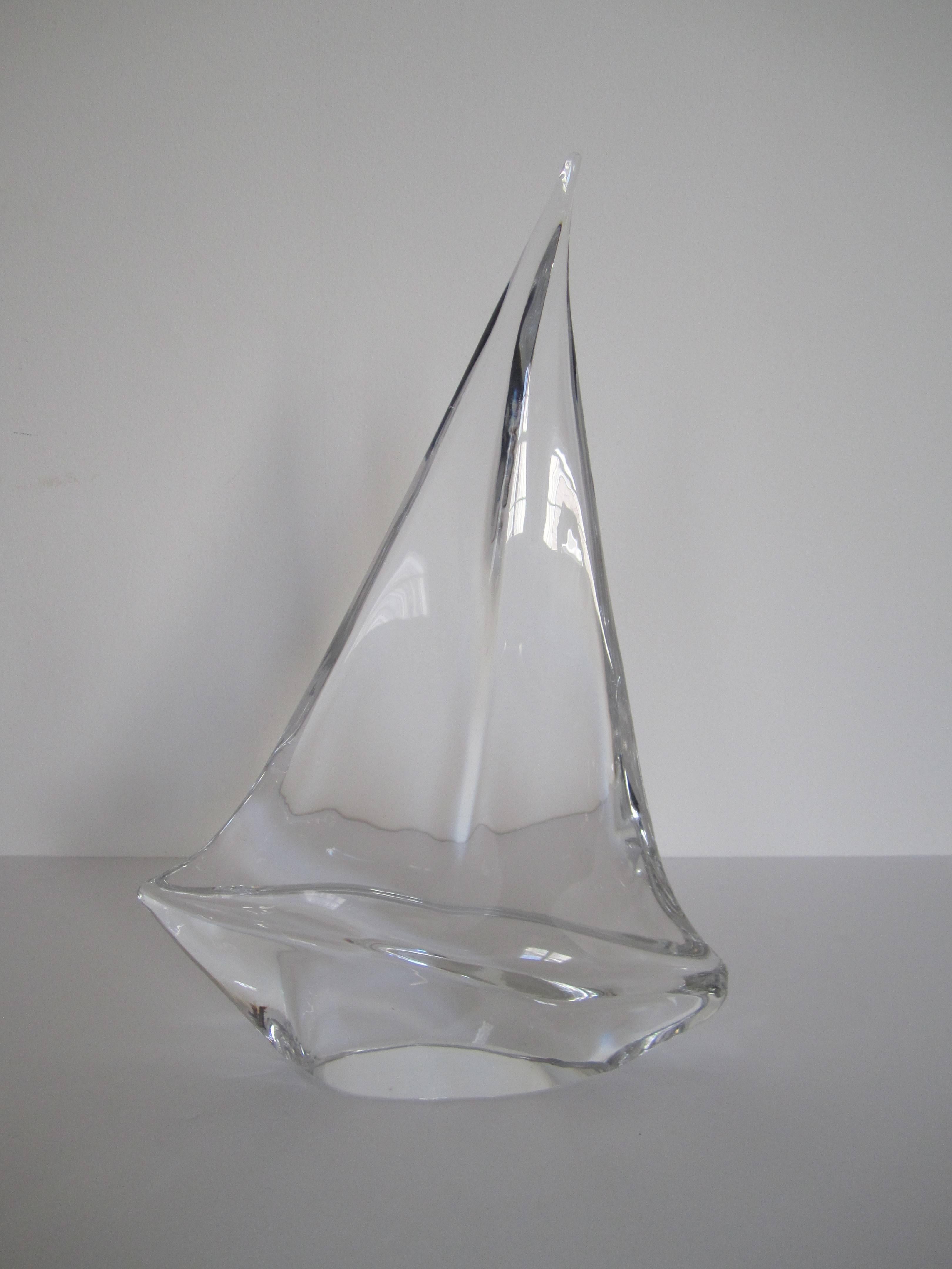A substantial sculpture of a sailboat yacht by French luxury crystal maker Daum. Piece is signed DAUM. Excellent condition. Made in France.

Measuring 13.5 in. H. 

Item available here online. By request, item can be made available by appointment to