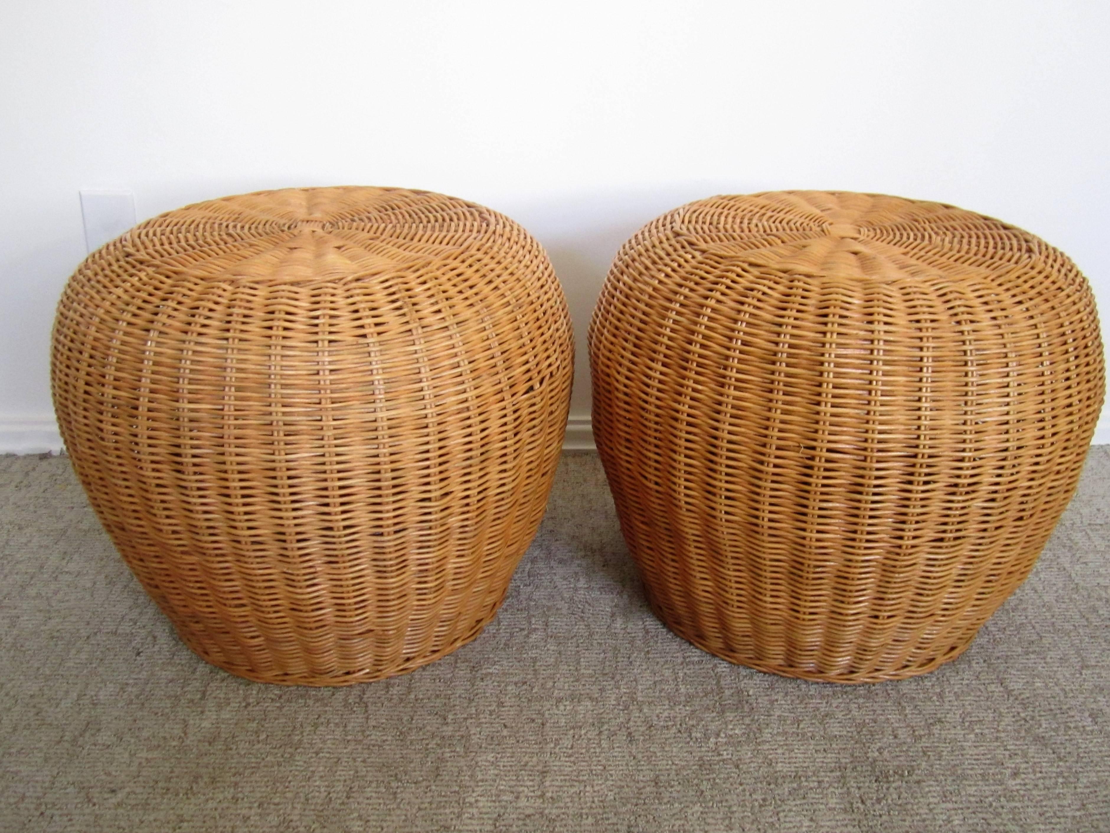 A pair of vintage European wicker round ottomans, benches, or stools. Can be used as seating or as side tables or cocktails tables. Versatile. Circa 1970s. Pair available here online, and by request, can be made available by appointment to the Trade