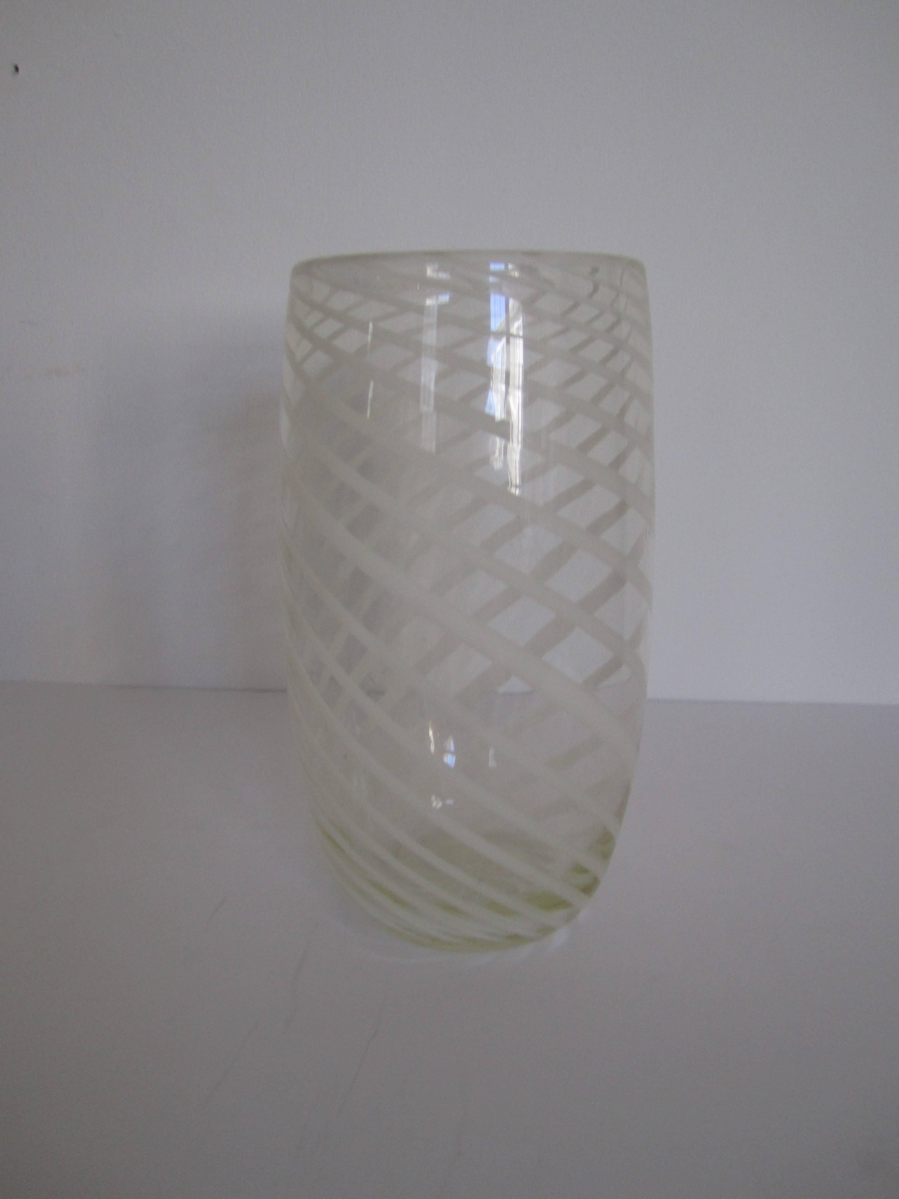 A beautiful clear blown glass vase with swirled white ribbon design in the syle of Italian designer Ercole Barovier. 

Vase measures: 10