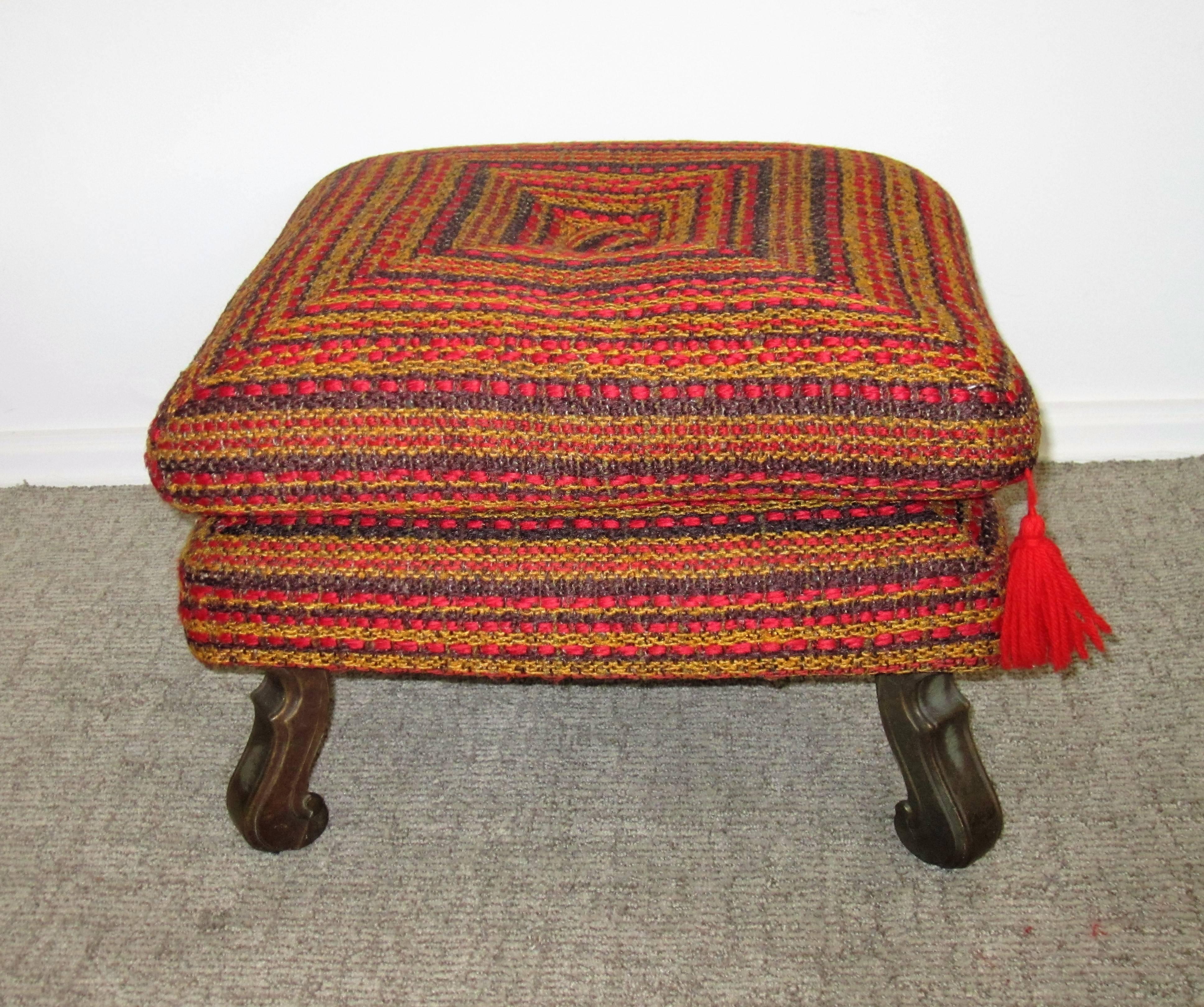 A vintage Midcentury colorful ottoman, bench, or stool. Pillow top is removable and base is firm - firm enough to hold a cocktail (as show in images.) Hue's include: red, orange, yellow, and blue, with decorative metal legs. 


