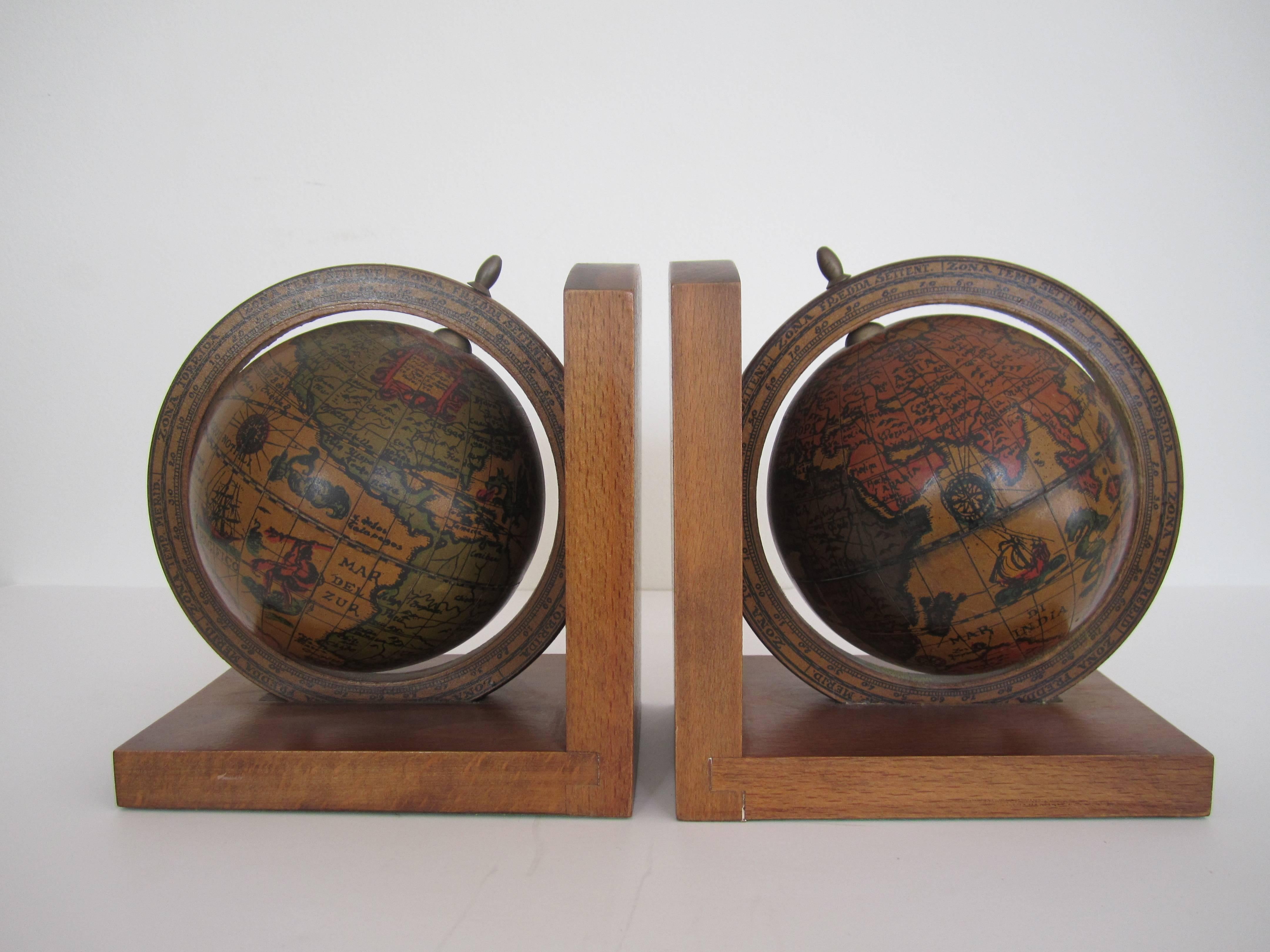 A pair of vintage world globe bookends that spin. 6.25