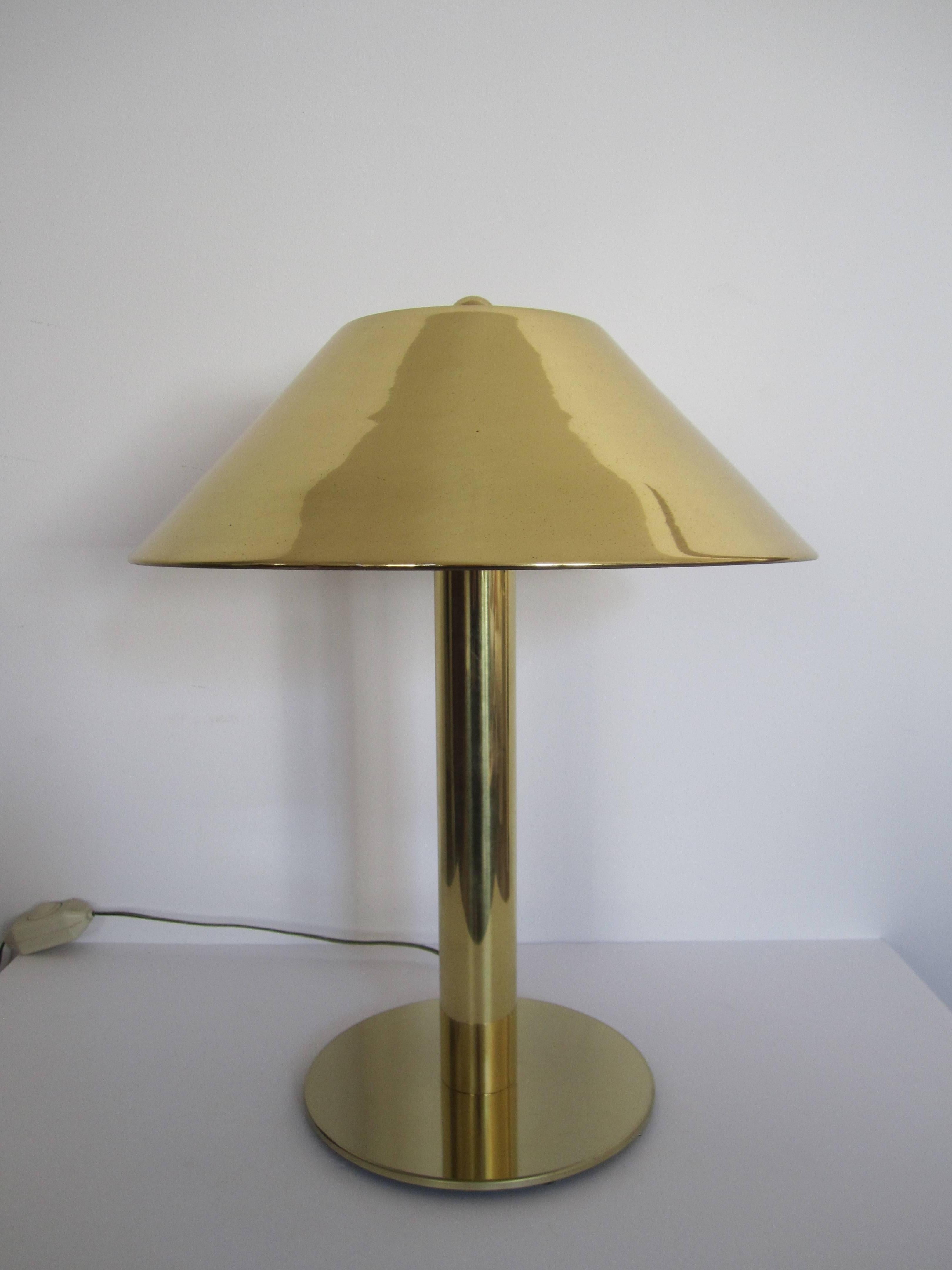 A vintage Modern style brass table or desk lamp after Designer Pierre Cardin, circa 1980s - 1990s. Lamp has brass shade and brass finial, with dimmer/on/off switch on cord. Takes two light bulbs. 

Measures: 20 in. H x 9.5 diameter base. 

Item