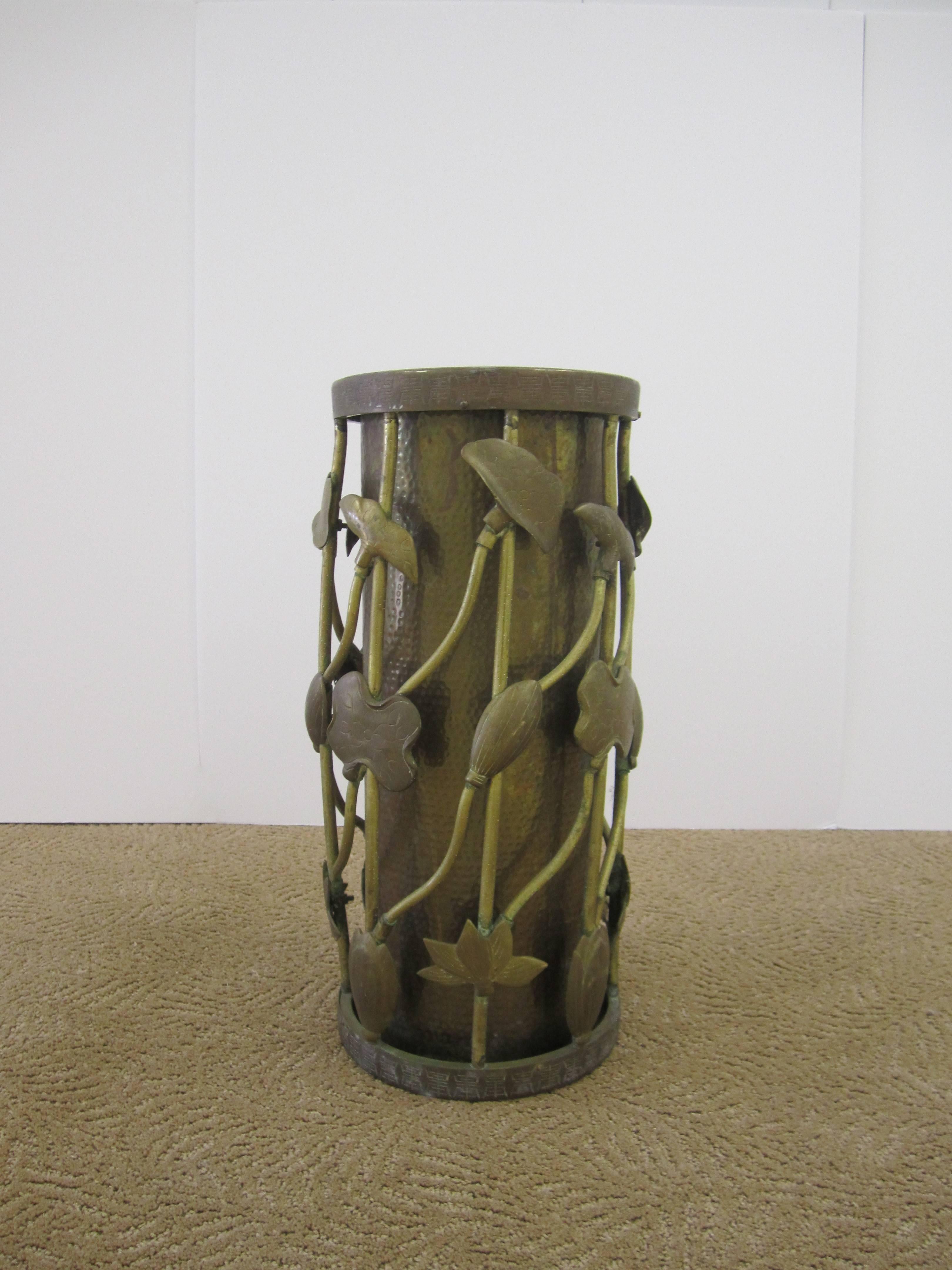 A beautiful mid-20th century brass umbrella stand with Lotus leaf, flower, and vine design in the Art Nouveau or Organic Modern style. Stand has a beautiful brass patina as show in images. With maker's mark on bottom as show in image #10. Ardalt was
