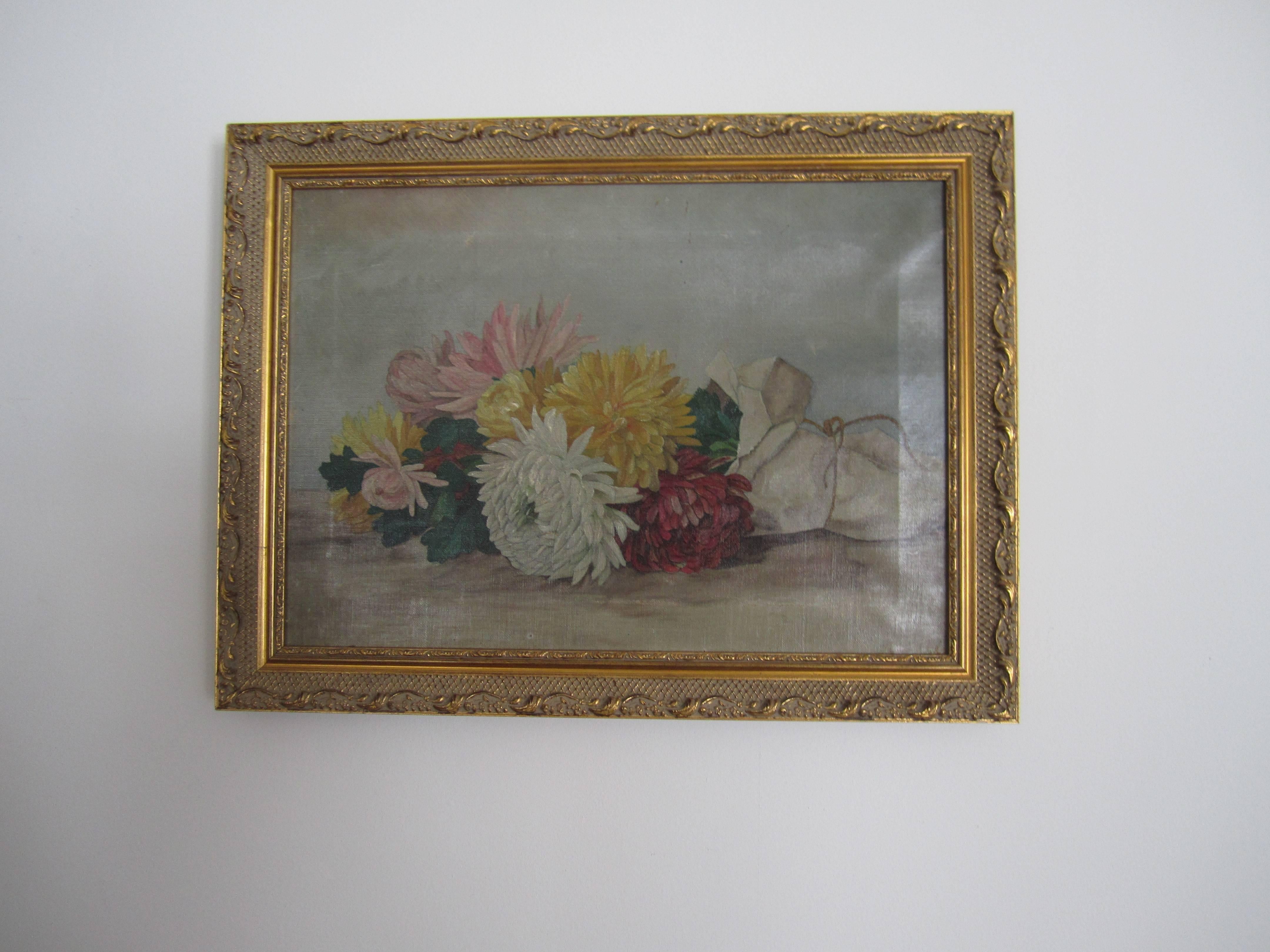 A late 19th century - early 20th century colorful still life painting. Painting depicts a 'fresh bouquet of flowers' wrapped in paper with string tie. Painting is on a stretched canvas, surrounded by a giltwood frame. Colors include: green, yellow,