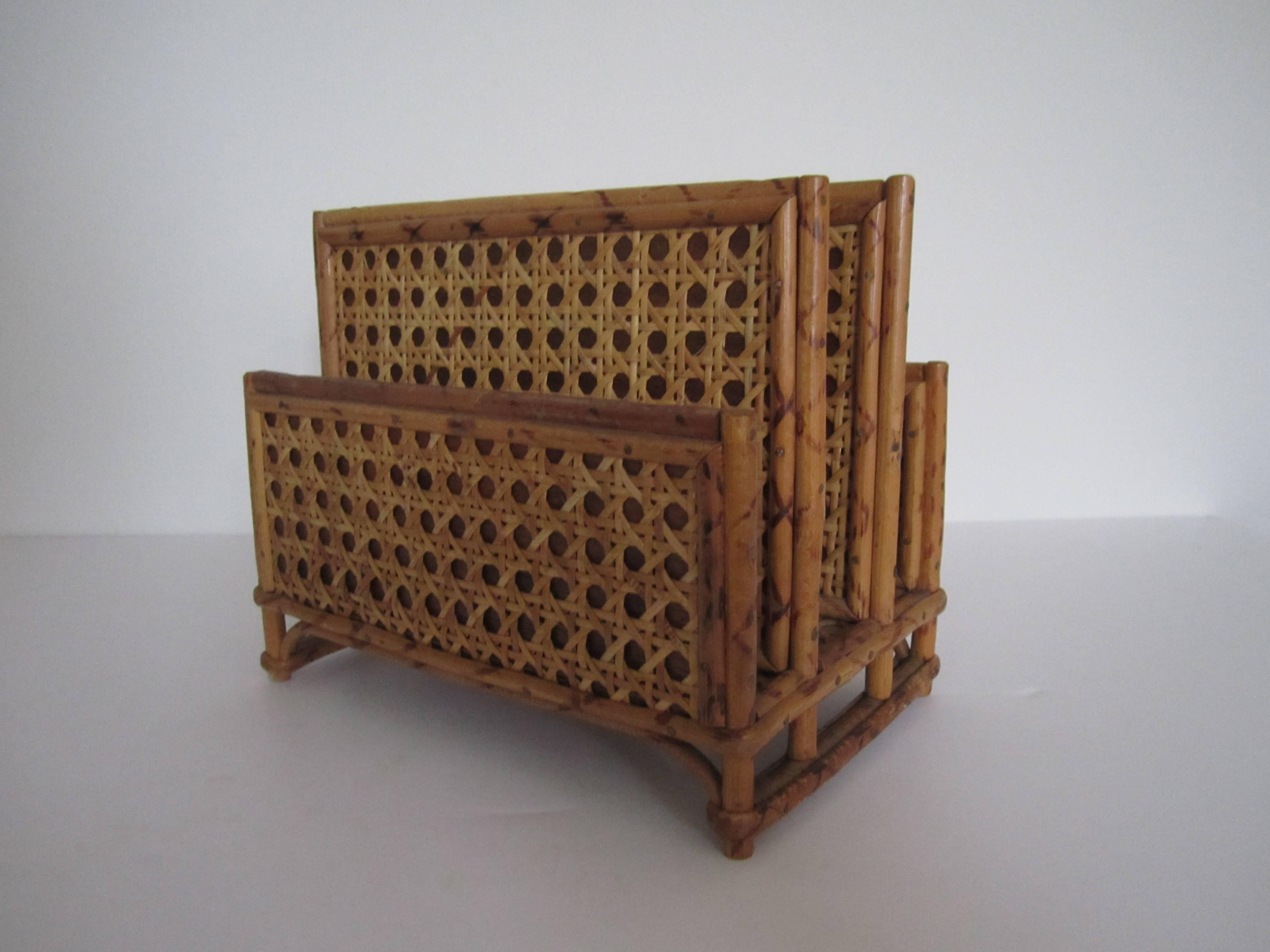 A chic vintage bamboo and rattan letter or mail holder with four compartments, circa 1970s. Measurements include: 7"h x 8.5"w x 5.5"d.  Item available here online. By request, item can be made available by appointment to the Trade (in