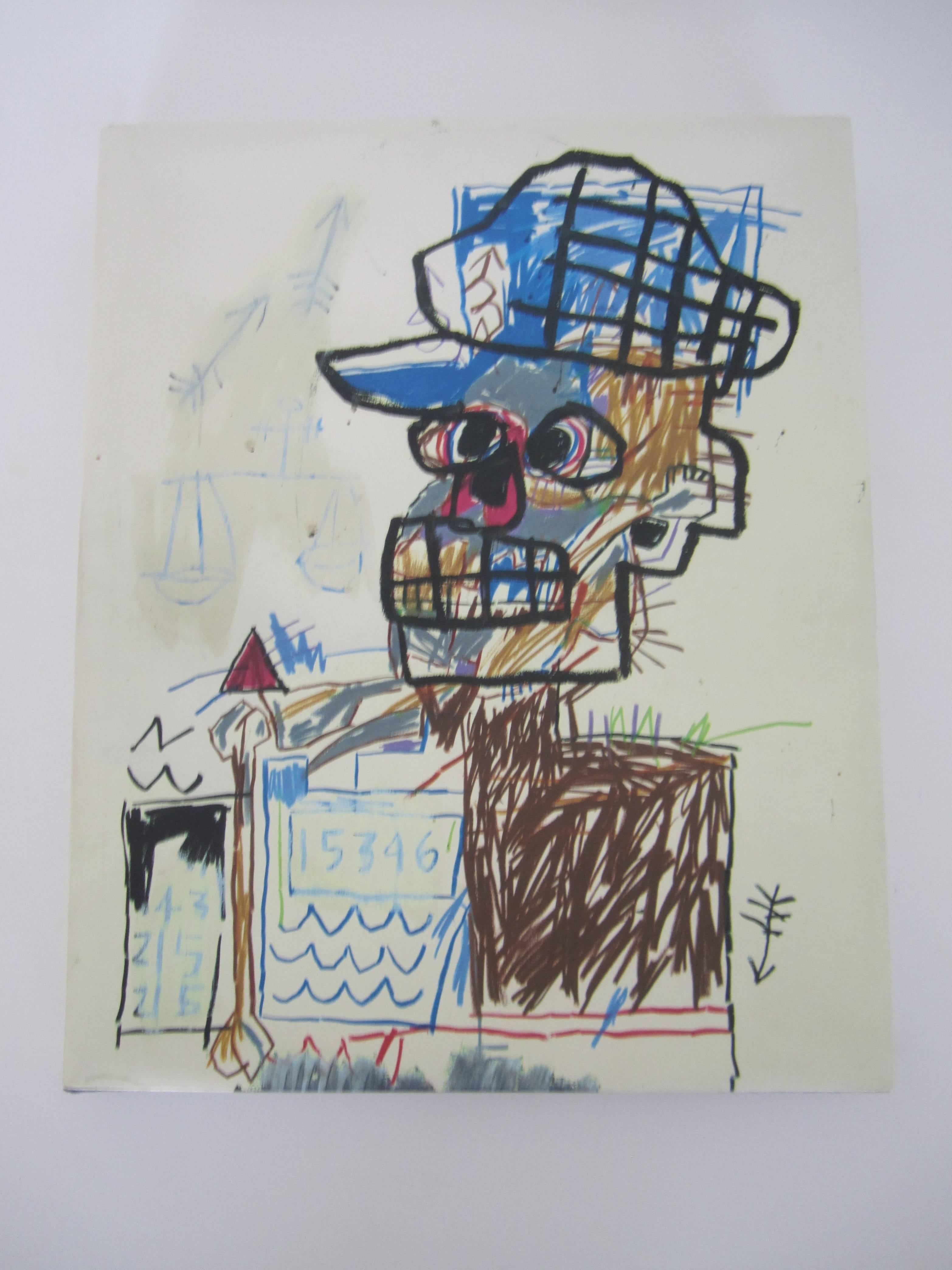 A Jean-Michel Basquiat drawing coffee table or library book. A story, with original writing and work, of the Brooklyn born artist from a private New York collection. Book is 'perfect bound hard cover' with a folded 'dust jacket' cover.