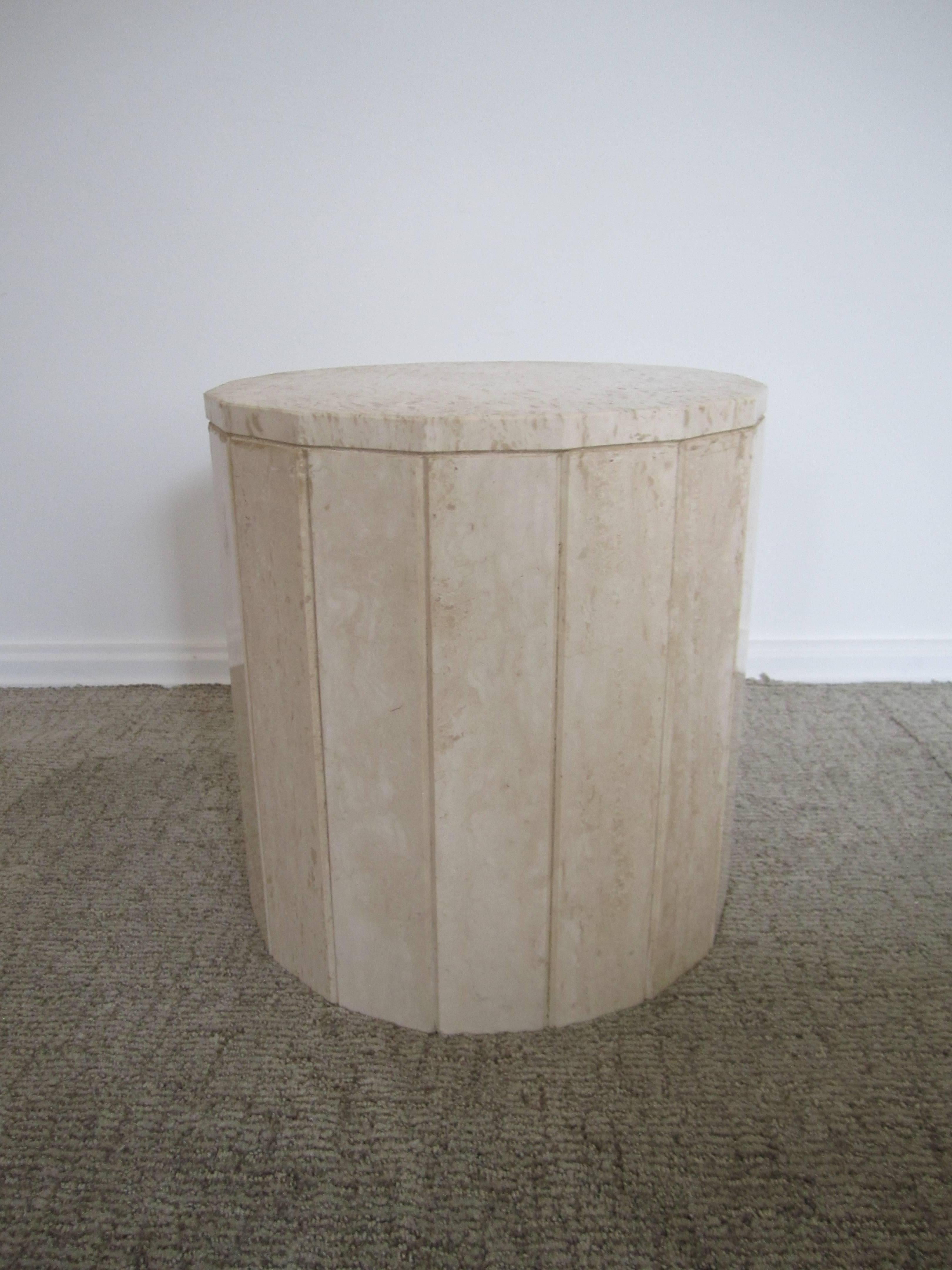 A substantial Italian travertine marble Modern style round side table or pedestal table, circa late-20th century, Italy. Travertine is 'beige' or 'sand' in color. Side table has a 'hexadecagon' shape of 16 sides. Table is very substantial so it can