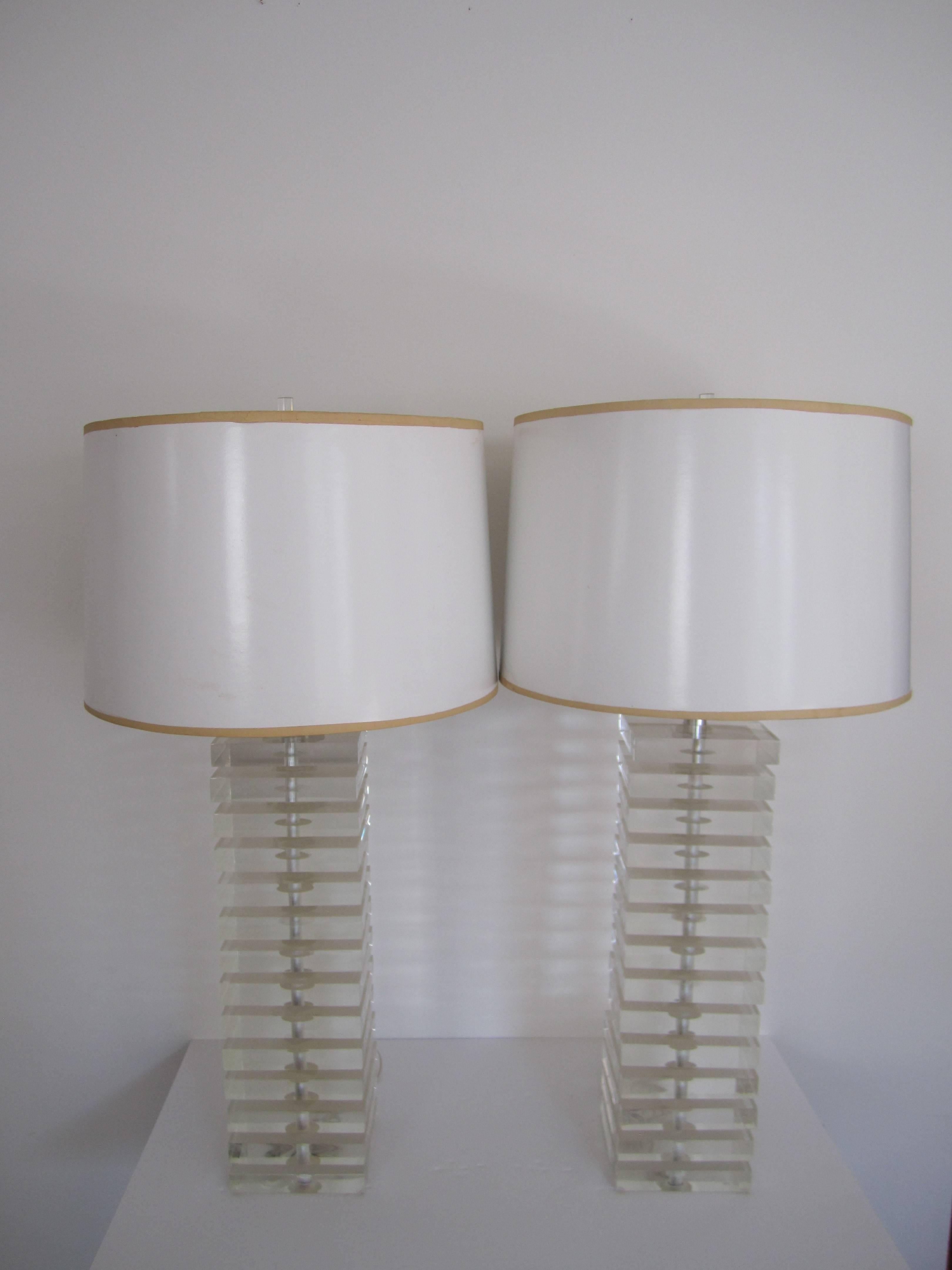 A pair of tall, substantial, Modern style or Postmodern period Lucite table lamps with Lucite finials, by designer George Bullitt, circa 1980s- 1990s. Lamps are marked on socket with designer label (image #12.) In working order. 

Measurements