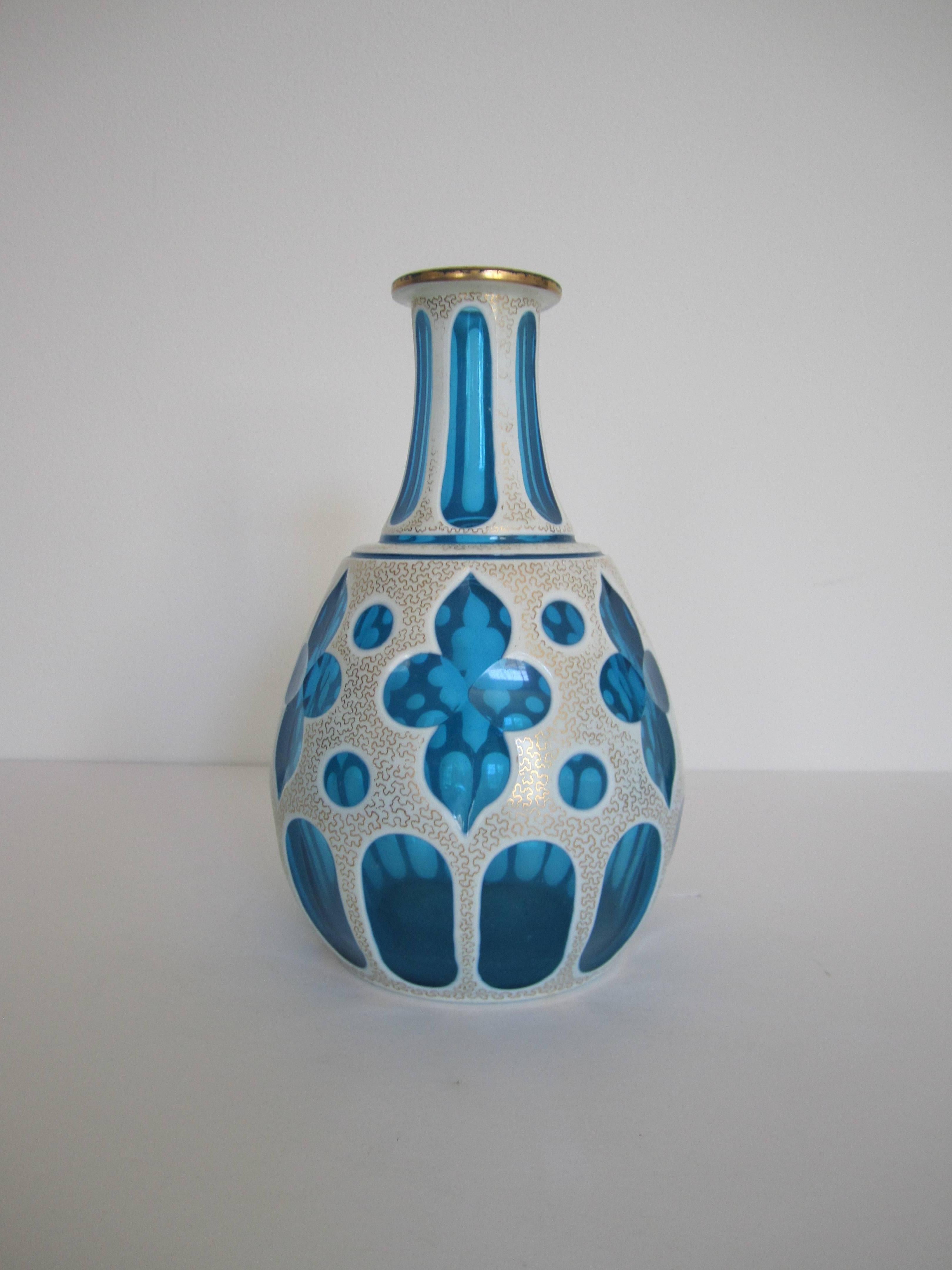 A very beautiful and rare turquoise or azure blue, white and gold Bohemian overlay cut glass vessel or vase, circa early-20th century, Czechoslovakia. Piece has gold detail with white overlay glass that's 'cut' to blue glass. A chic piece for a bath