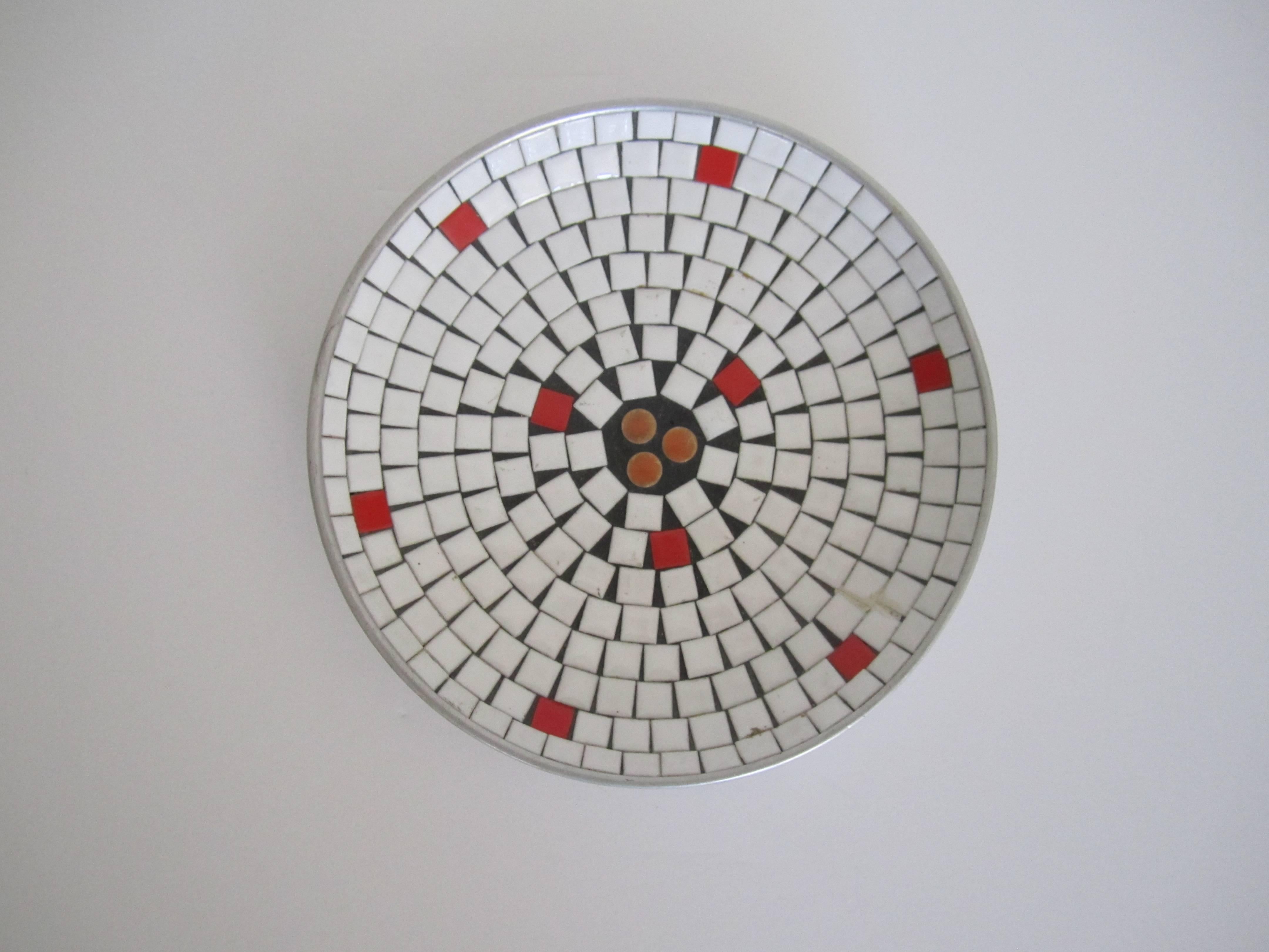 A very beautiful Mid-Century Modern white mosaic ceramic tile dish or bowl, circa 1960s. Bowl is made of predominantly white tiles, with touches of red and orange; nine red around and three round orange tiles in center. 

Measuring: 7.5