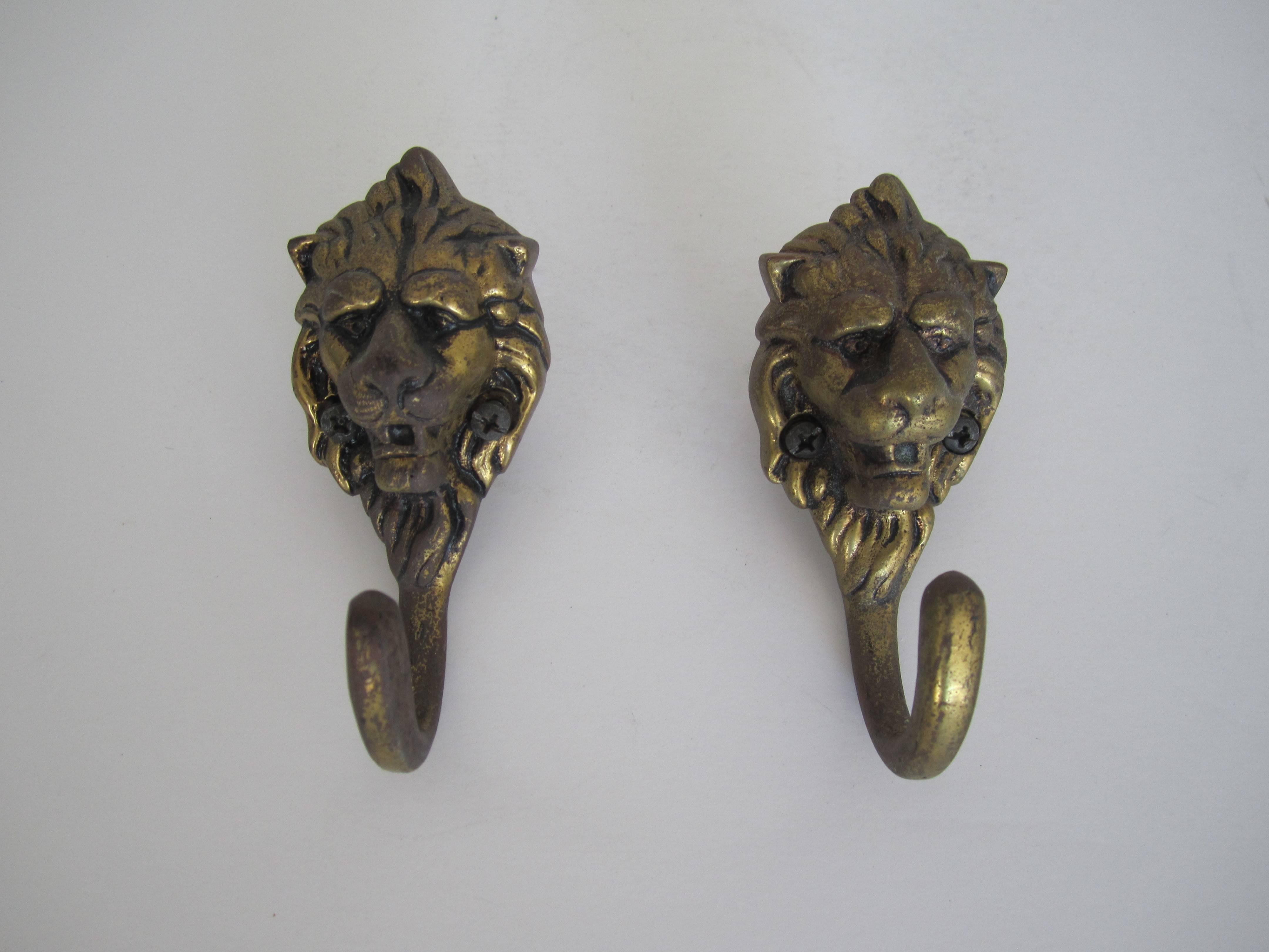 A vintage pair of European brass lion head hardware wall hooks.
Pair available here online. By request, pair can be made available by appointment to the Trade (in New York).

Alternatively, by request, pair can be made available for viewing in my