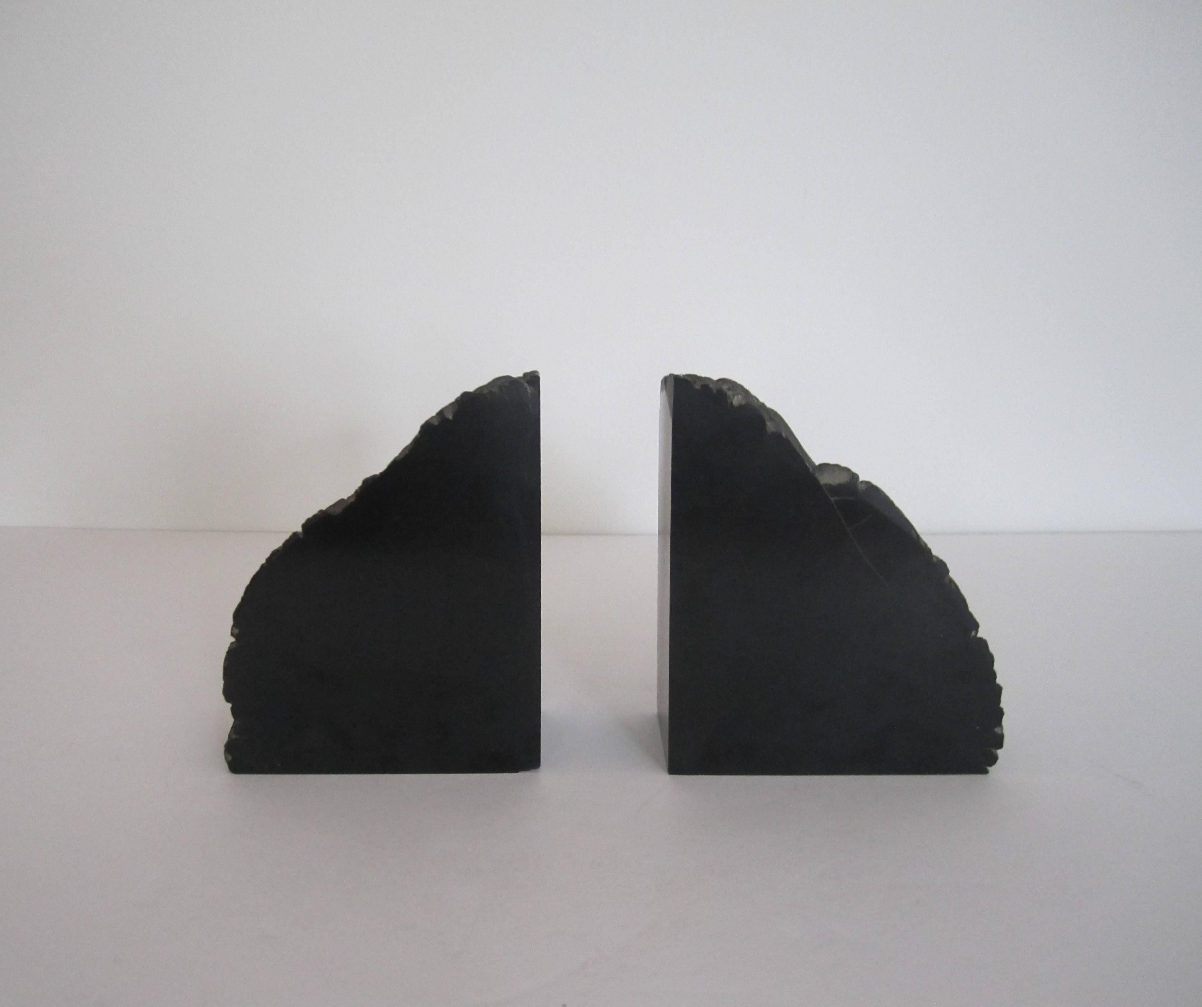 A pair of vintage jet black polished natural stone bookends. 
Measurements include: 5