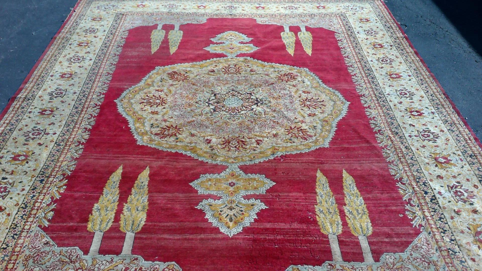 A gorgeous, large, predominantly red, antique Turkish Sivas rug. A beautiful one-of-a-kind rug with a large independent center medallion and a wide an elaborate decorative border. Colors include: red, cream, gold and blue. 

Measures: 10' 8