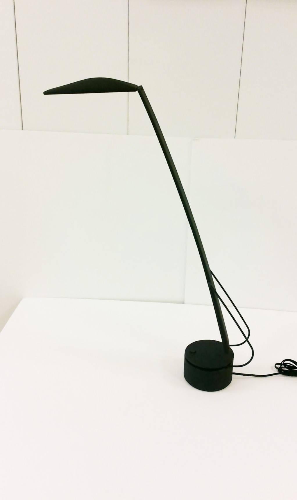 A Post-Modern black reading, desk, or task lamp, DOVE, by Italian designers Mario Barbaglia and Marco Colombo for PAF Studio. Flexible lamp and shade and a base that effortlessly turns 360 degrees. On/off switch on top of base. Maker's mark