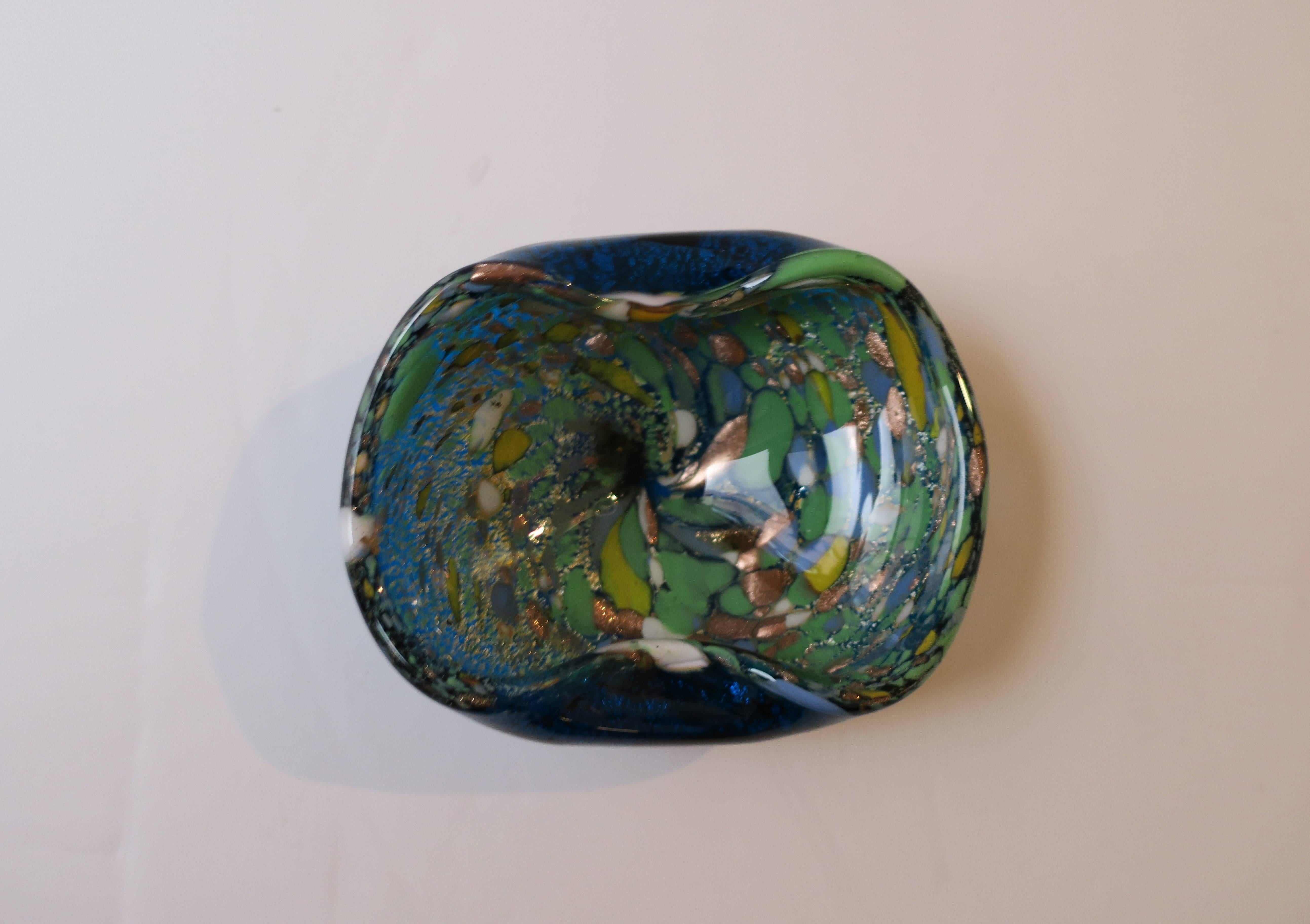 A beautiful small vintage Italian Murano art glass bowl, made of predominantly blue glass, but also with copper, gold, periwinkle blue, green, white and yellow, as shown in images. Bowl measures: 5