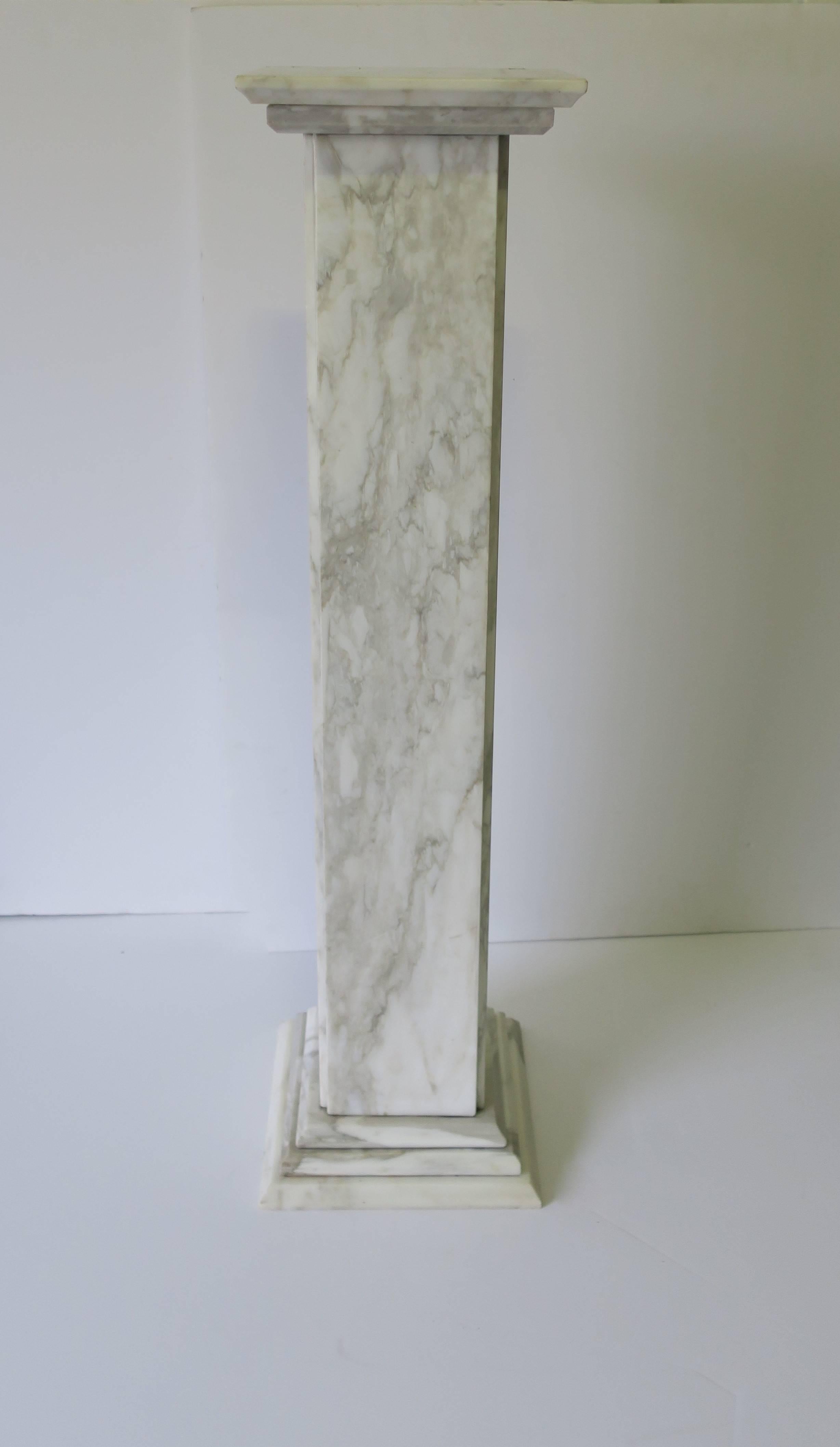 A vintage Italian, neoclassical style, marble pedestal or column. Marble is white with grey and tan veining. Beautiful veining and detailed base. Measurements include: Pedestal top is 9.5