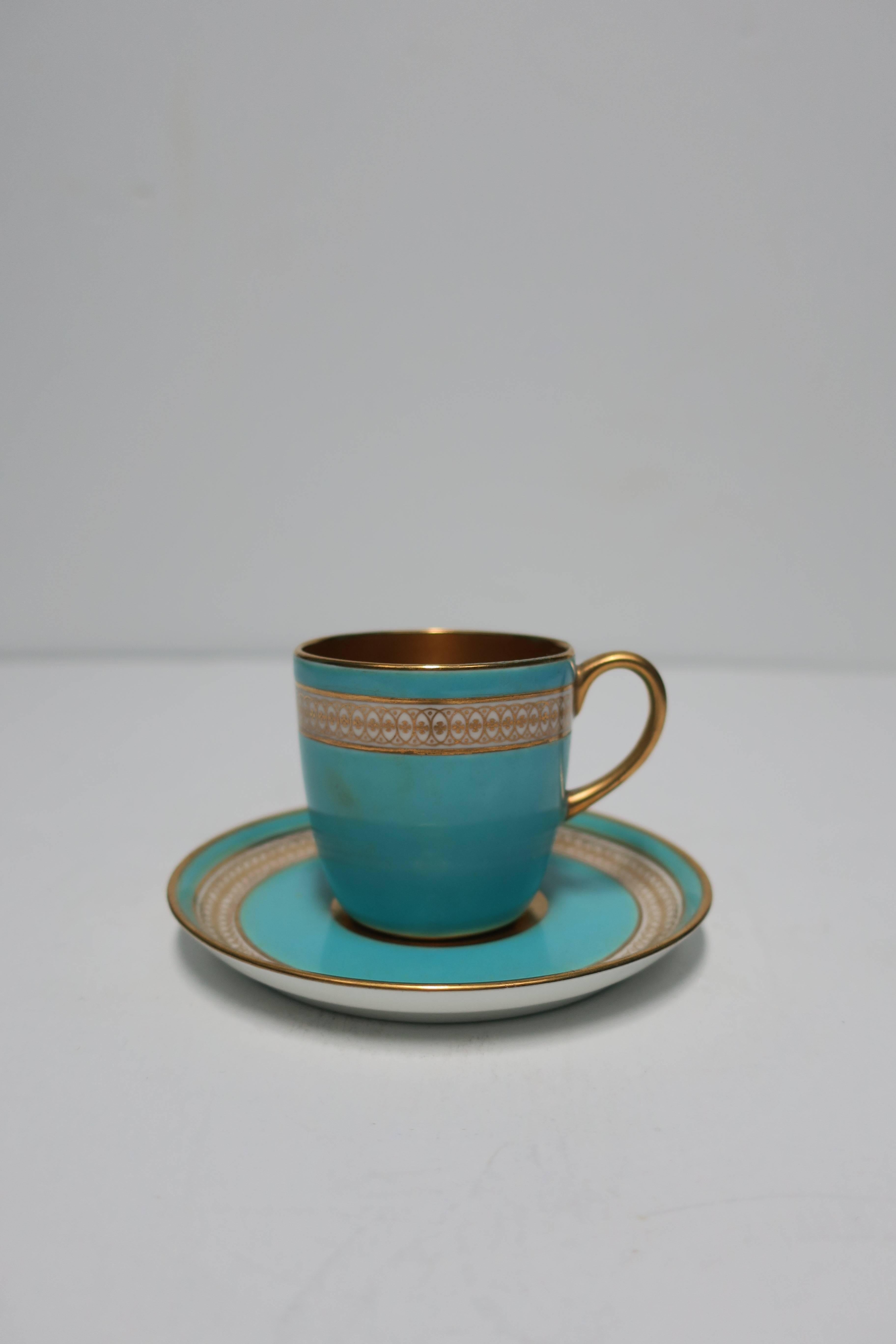 A beautiful English 24-karat, gold turquoise blue, and white porcelain, 'Demitasse' espresso coffee cup and saucer, England, circa early-20th Century. With maker's mark, and marked 'Made in England', on bottom as show in images #9 and 10.