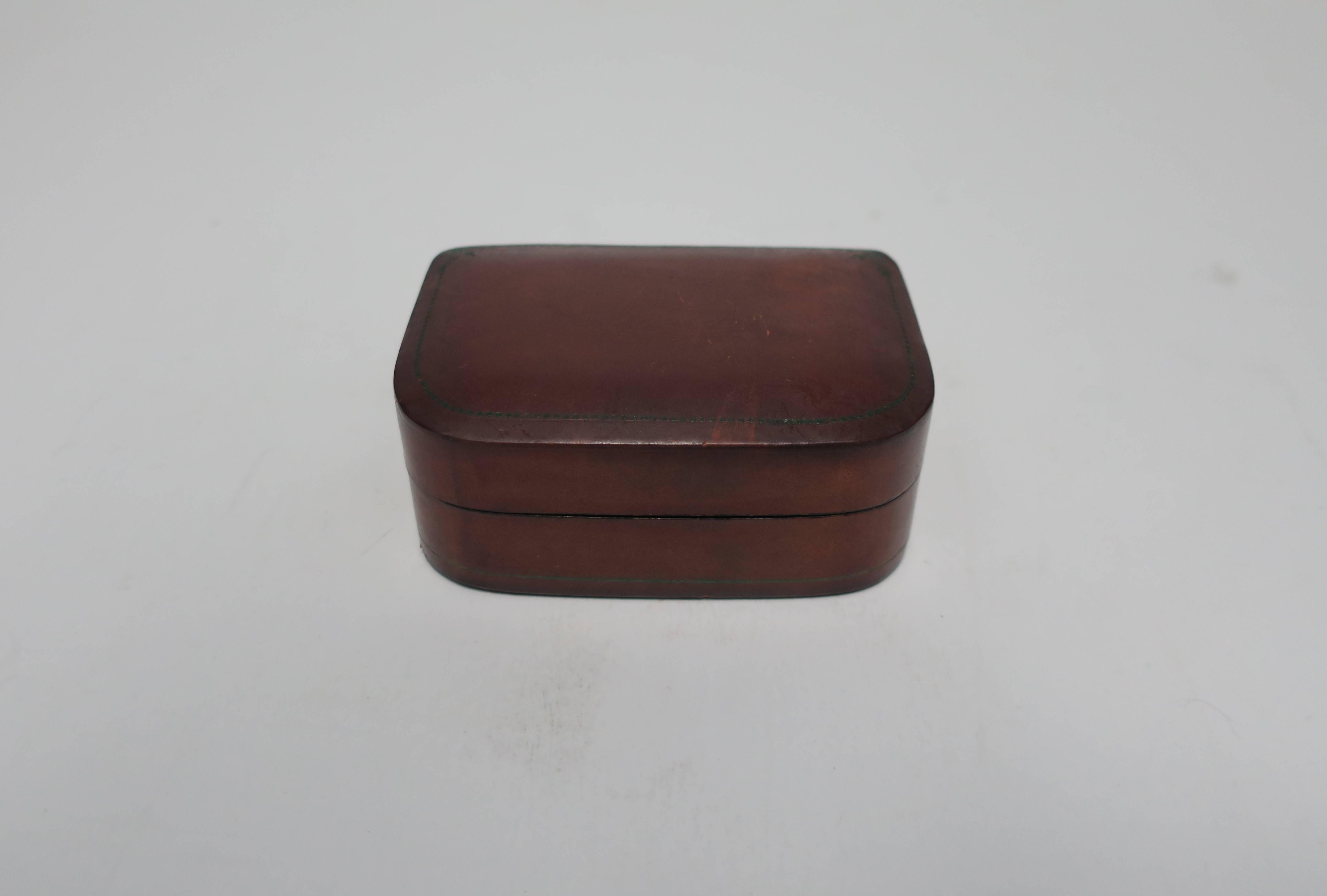 A small vintage Italian brown leather jewelry box with cotton velvet lining. Marked 