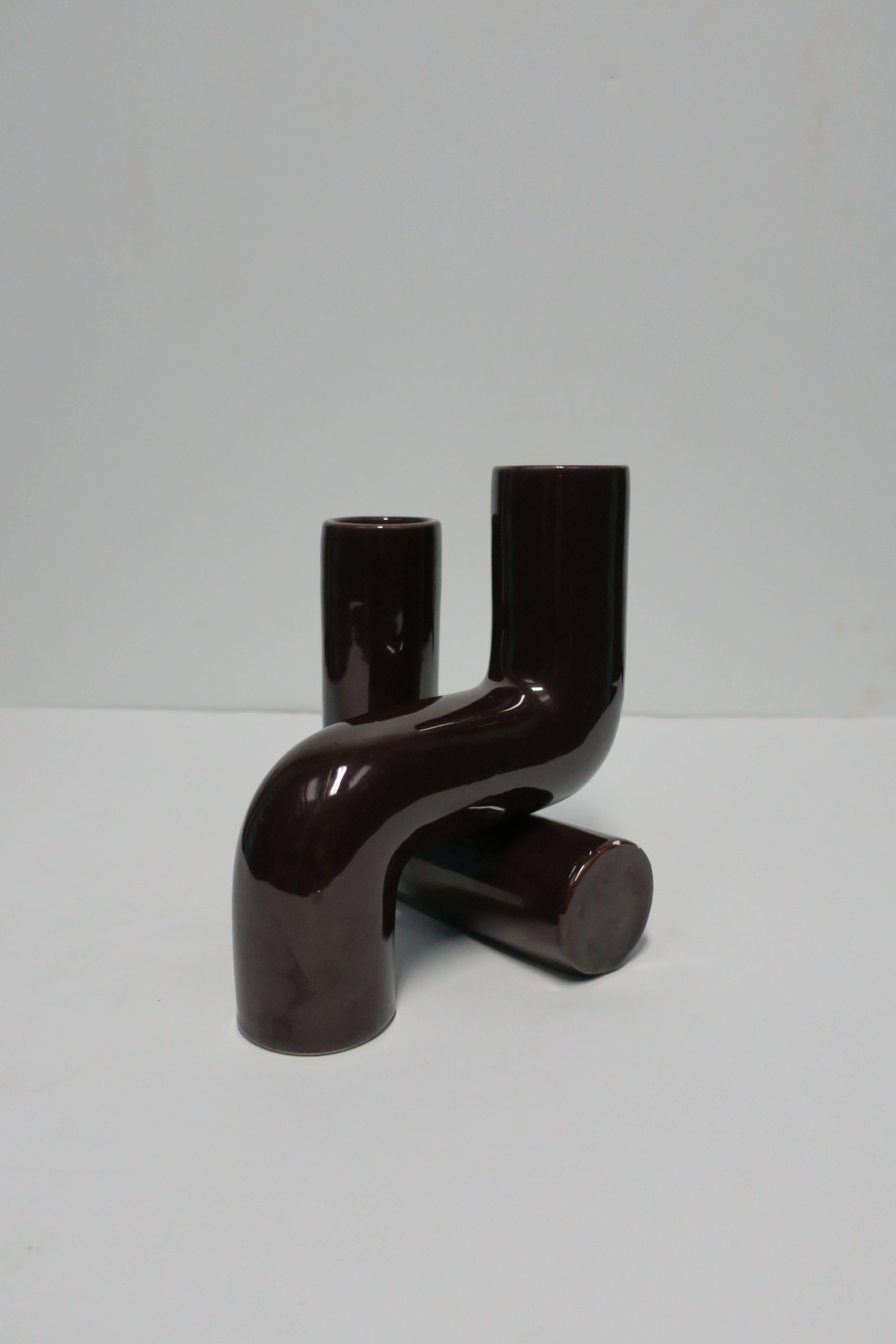 A Modern Italian geometric ceramic sculpture, Italy, 1960s. Sculpture is comprised of two dark brown glazed geometric sculpture pieces. Marked ITALY on bottom as show in image #10. 

Item available here online. By request, item can be made available