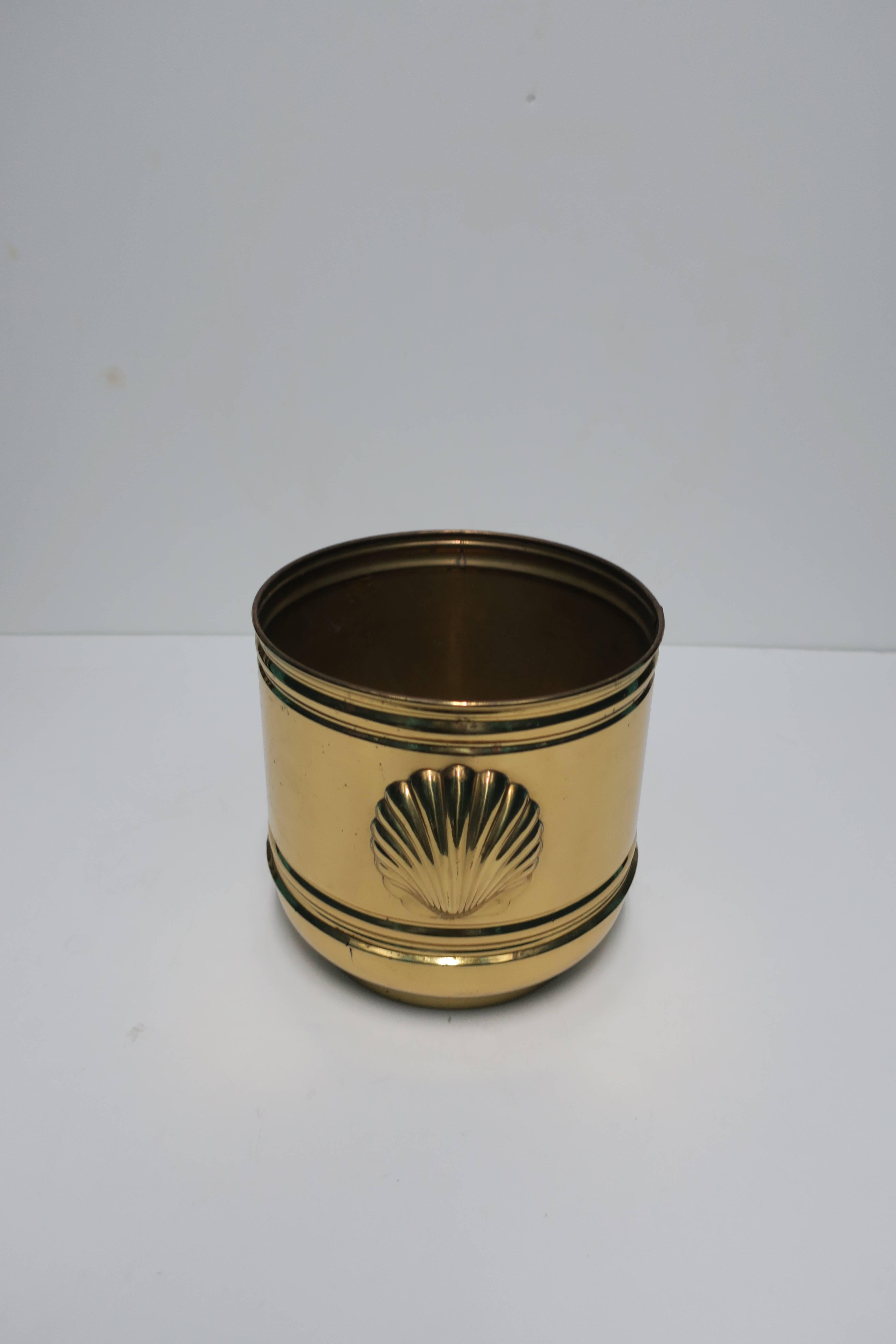 Vintage English brass decorative cachepot (flower or plant pot holder) with scallop shell detailing on two sides. Marked 