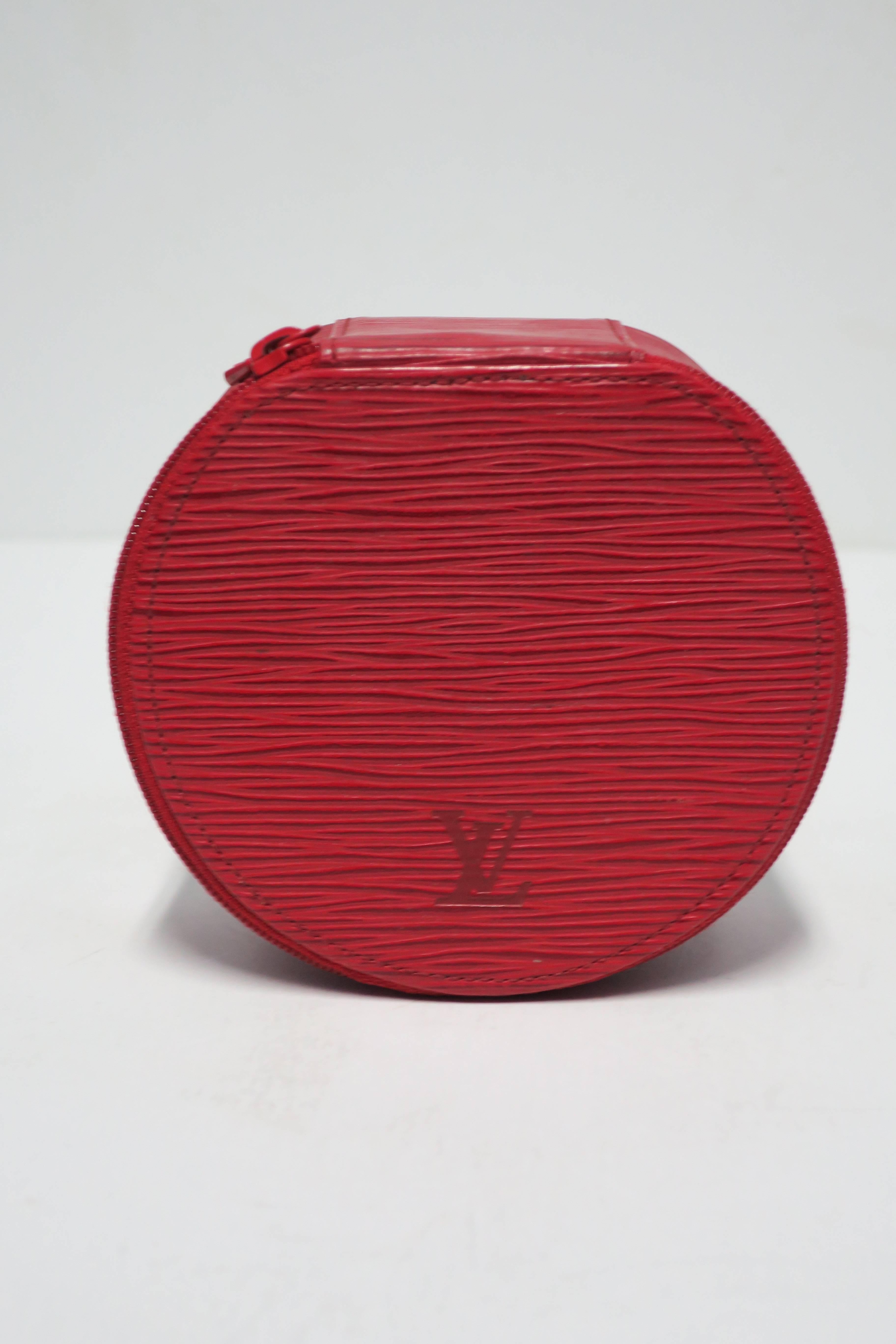 An authentic beautiful red LV Louis Vuitton epi leather travel jewelry box or case. Internal 'detachable ring' used to section off jewelry pieces as show in images. Multiple LV or Louis Vuitton marking's on outside and inside of box as show in