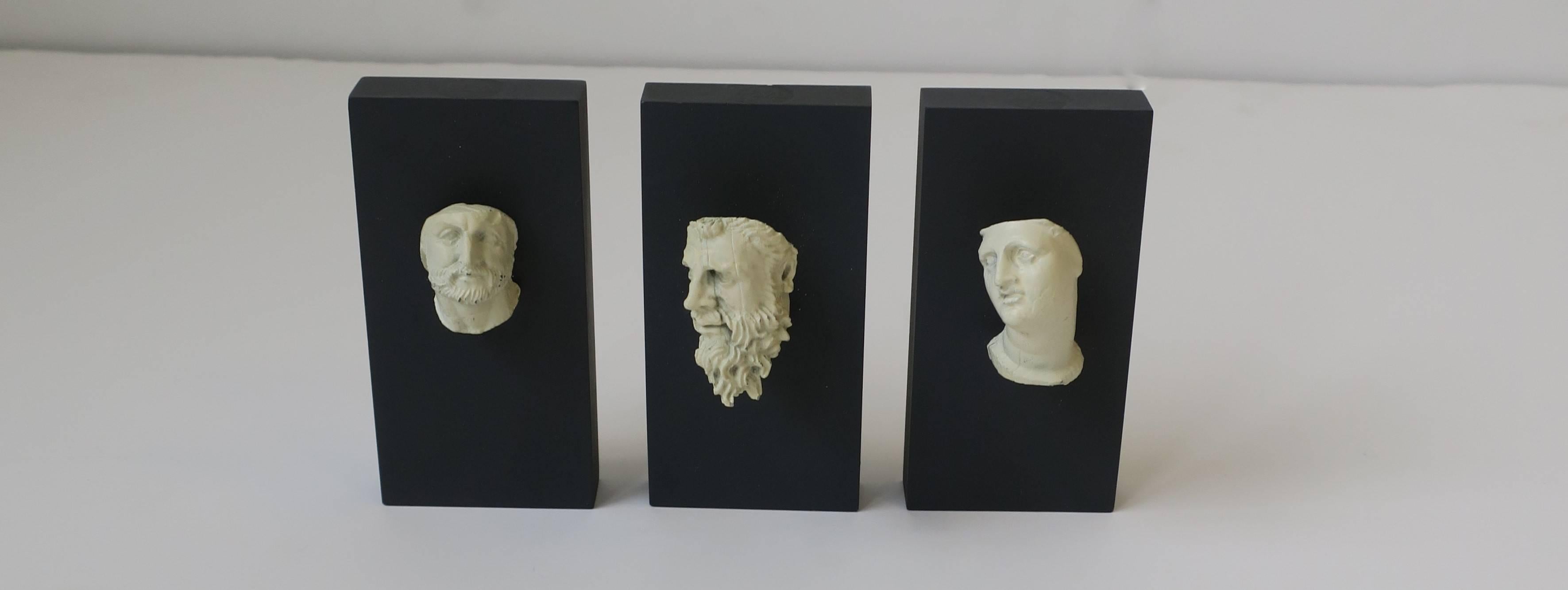 Set of 3 Available Here for $950

With a Minimalist feel, a chic three-piece set of mini Greek antiquity reproduction sculptures mounted to dark grey ceramic vertical bases. Description/history on back. 

Please note measurements: each measures 4