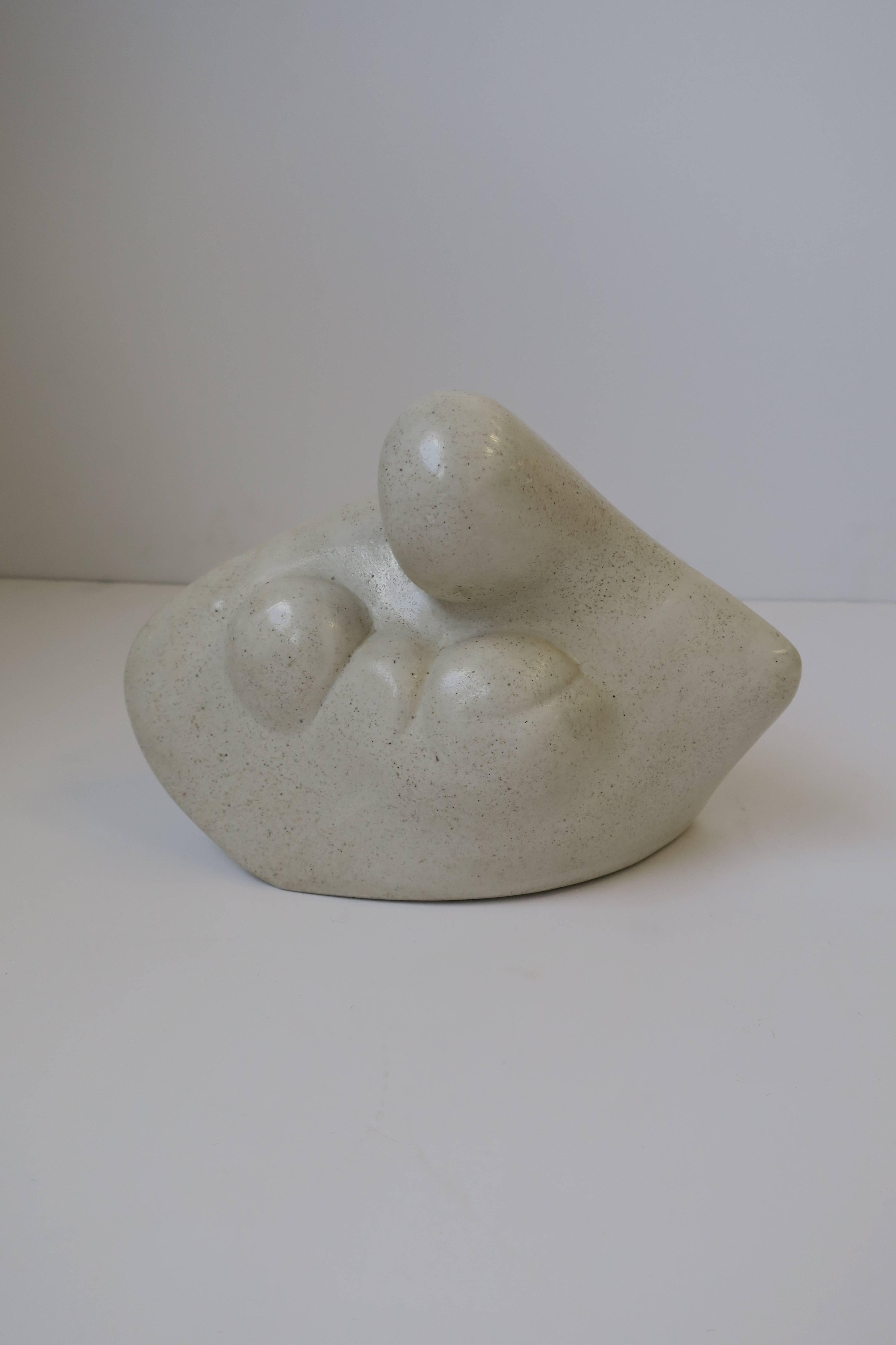 A beautiful signed post-modern mother-and-child hand-carved stone sculpture, circa 1980s. 

Measurements include: 6.5 in. H x 9 in. W x 5 in. D

Item available here online. By request, item can be made available by appointment to the Trade in New