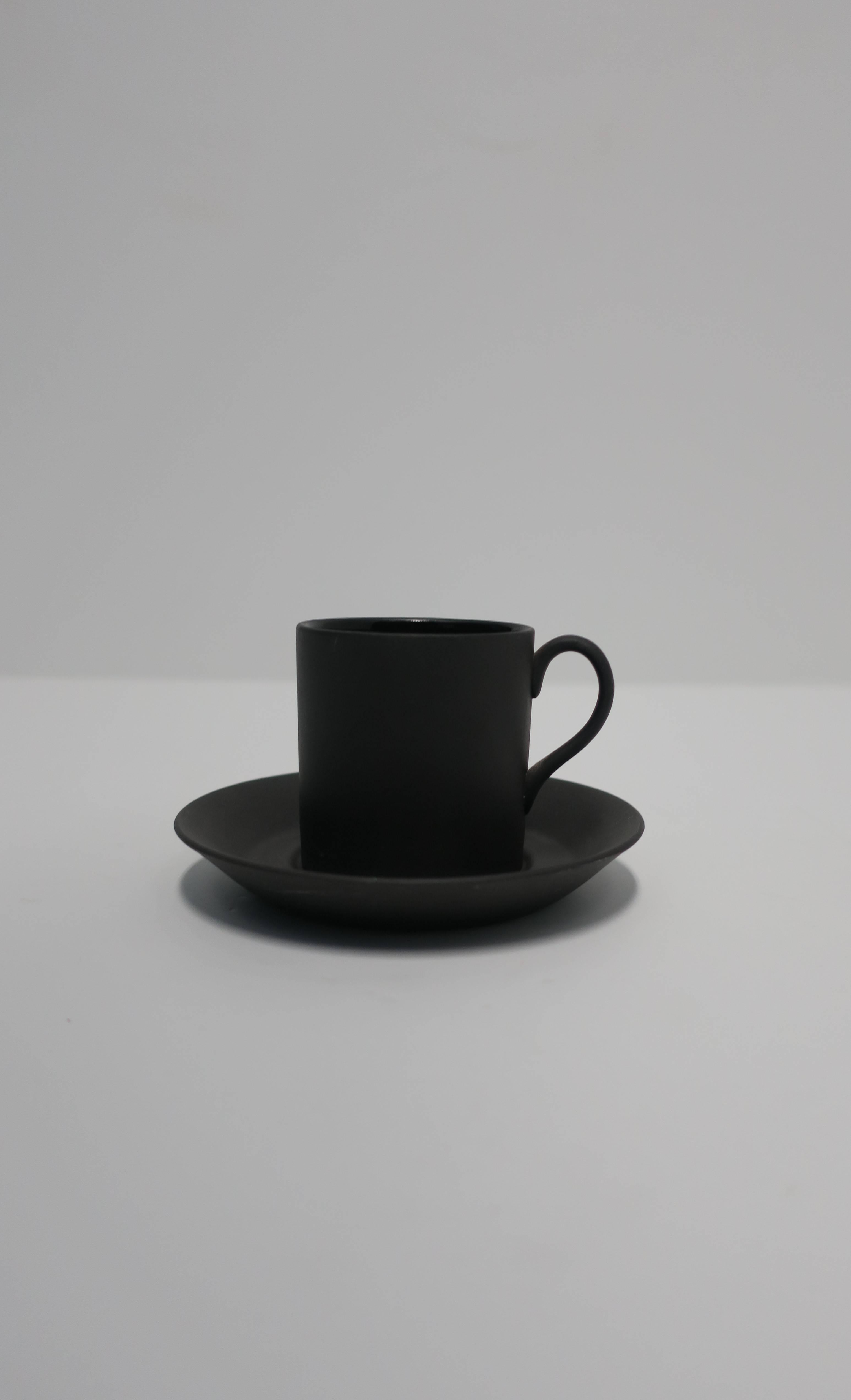 A beautiful matte basalt black espresso or demitasse cup and saucer, by Wedgwood, England. With maker's mark on bottom as show in images. Interior of cup is glazed smooth. Made in England.