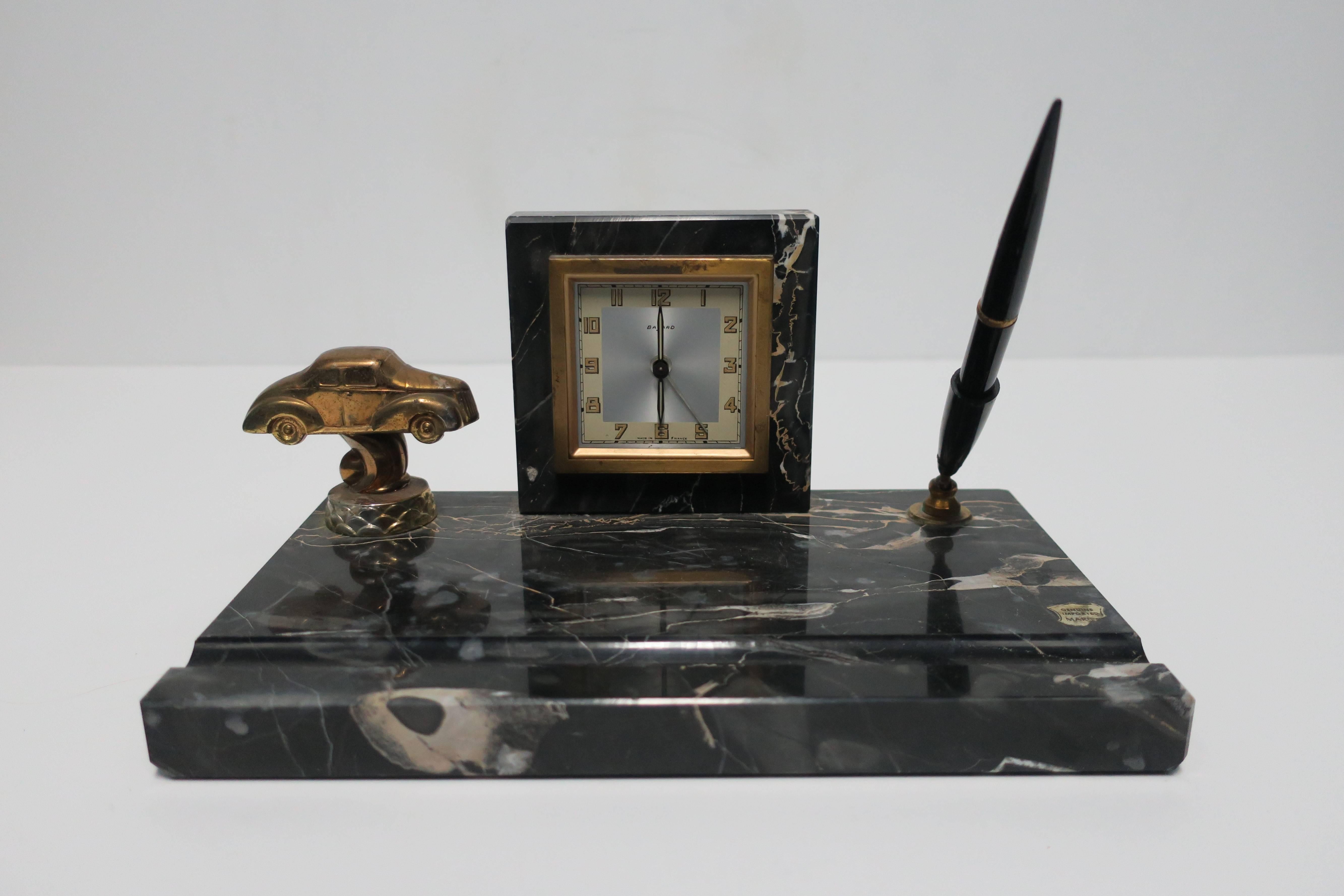 A beautiful and substantial French Art Deco black marble clock and pen desk set, circa 1920s -1930s. Piece is marked, Made in France, as show in images #7 and 8. 

