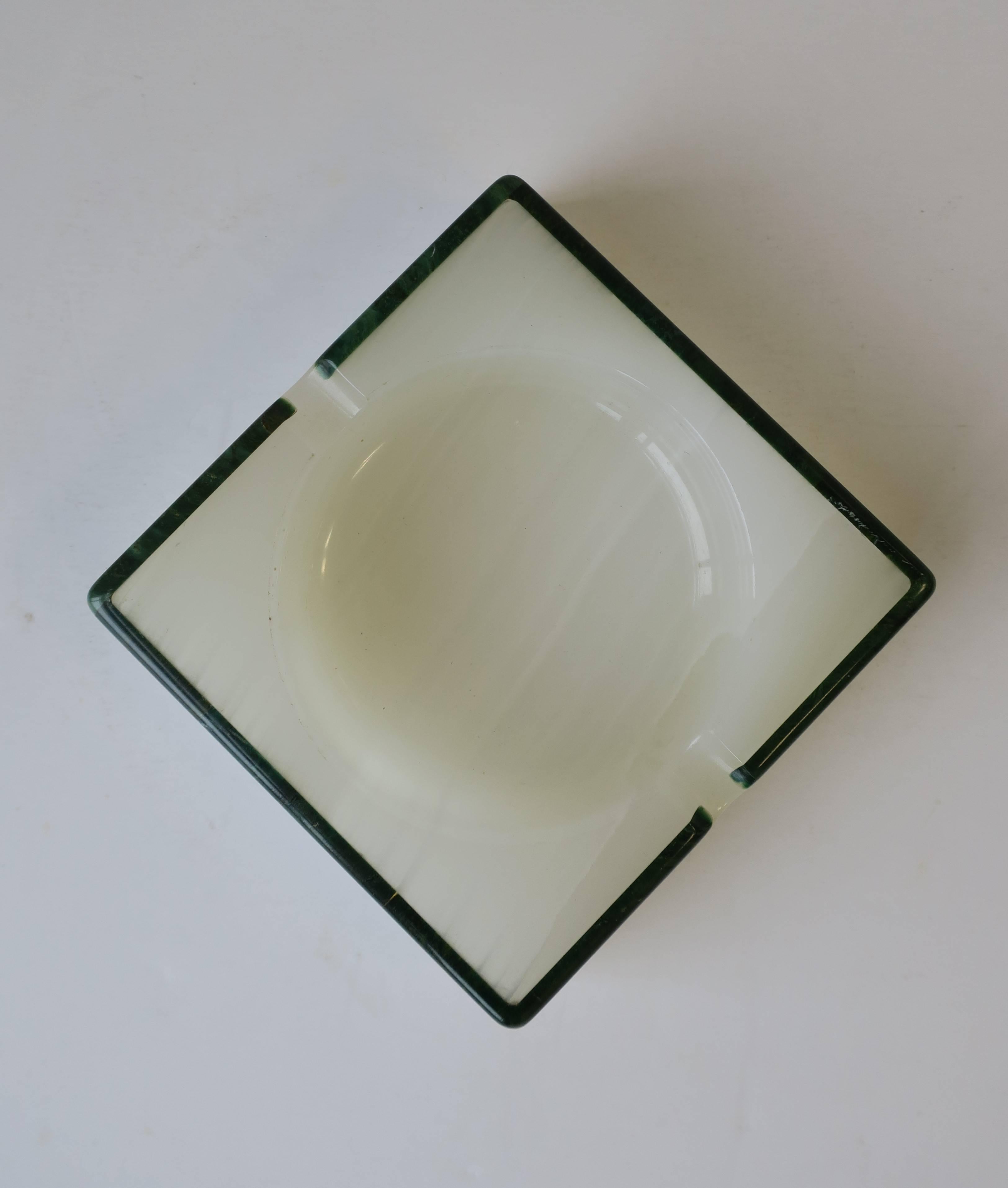 A beautiful vintage Modern Italian snow white alabaster marble and green marble or malachite trimmed vessel or ashtray. 

Item available here online. By request, item can be made available by appointment to the Trade in New York.
    