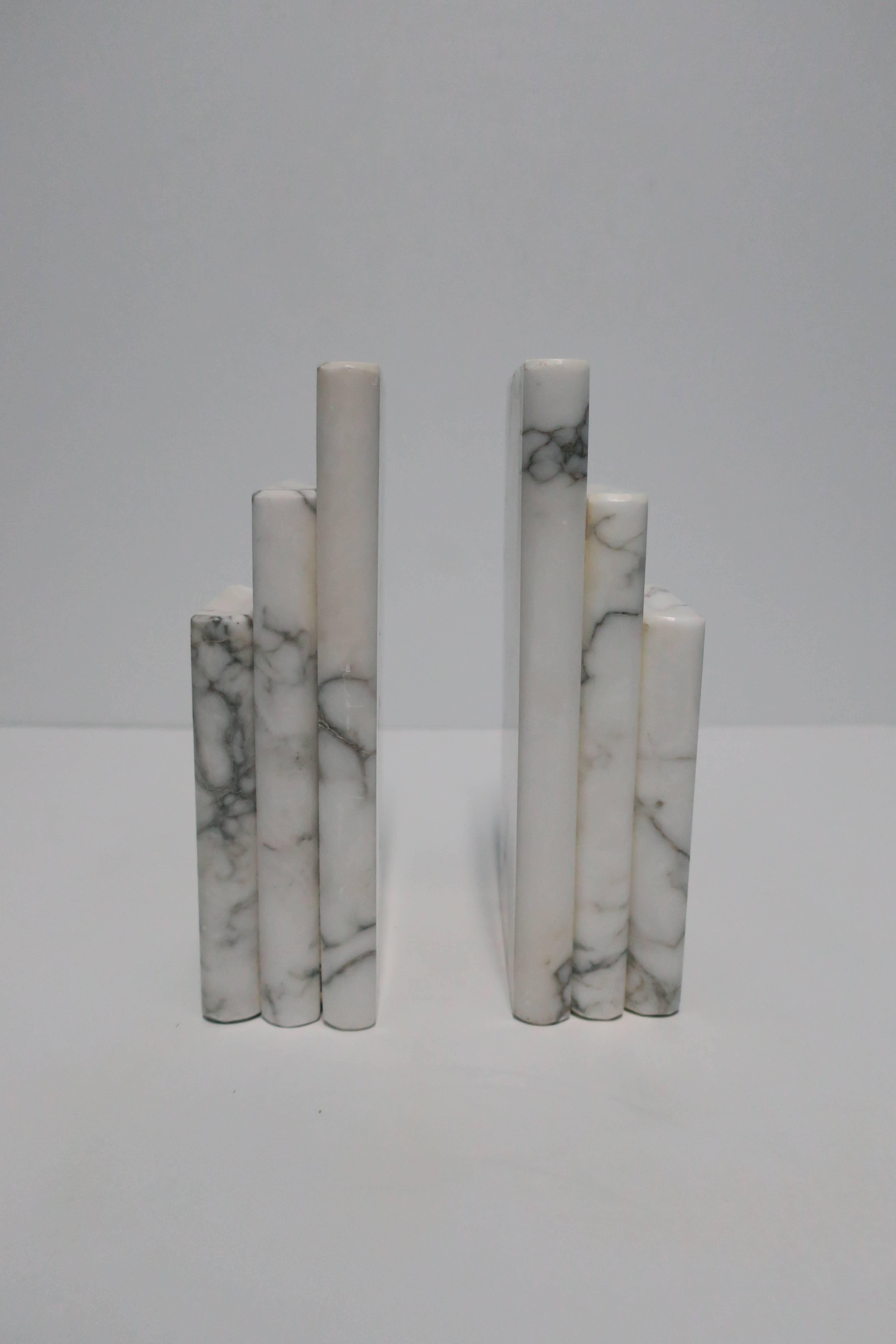 A beautiful and substantial pair of vintage Modern Italian white and black marble 'Book' bookends, Italy, circa 1970s. Marble is predominantly white with black/dark veining. Bookends are substantial; in images #9 and #10 they are shown supporting