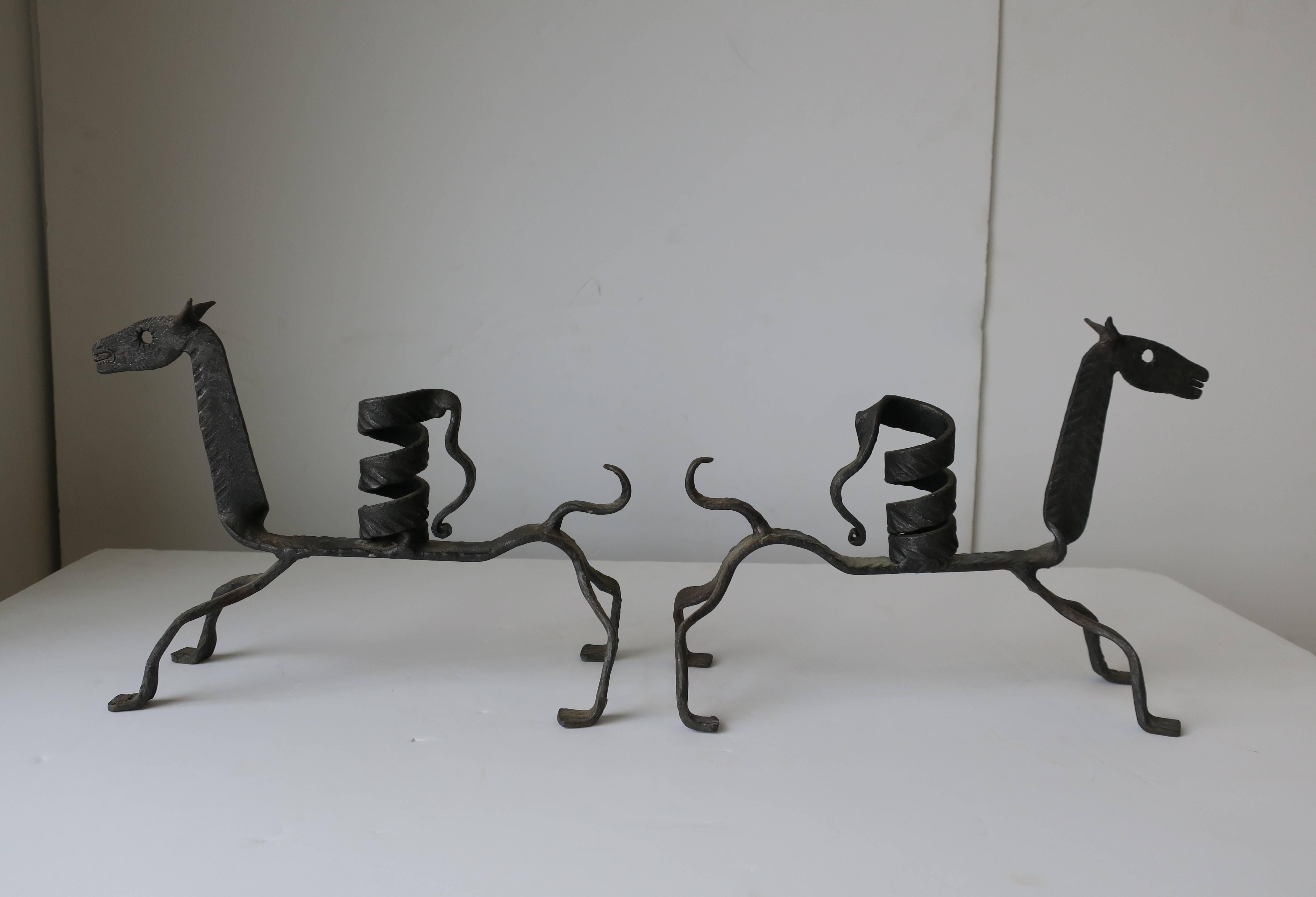 A beautiful pair of Spanish iron metal horse sculptures, decorative objects, and candlestick holders. Made in Spain (marked on hoof as show in image #8.) Dimensions: 10.5