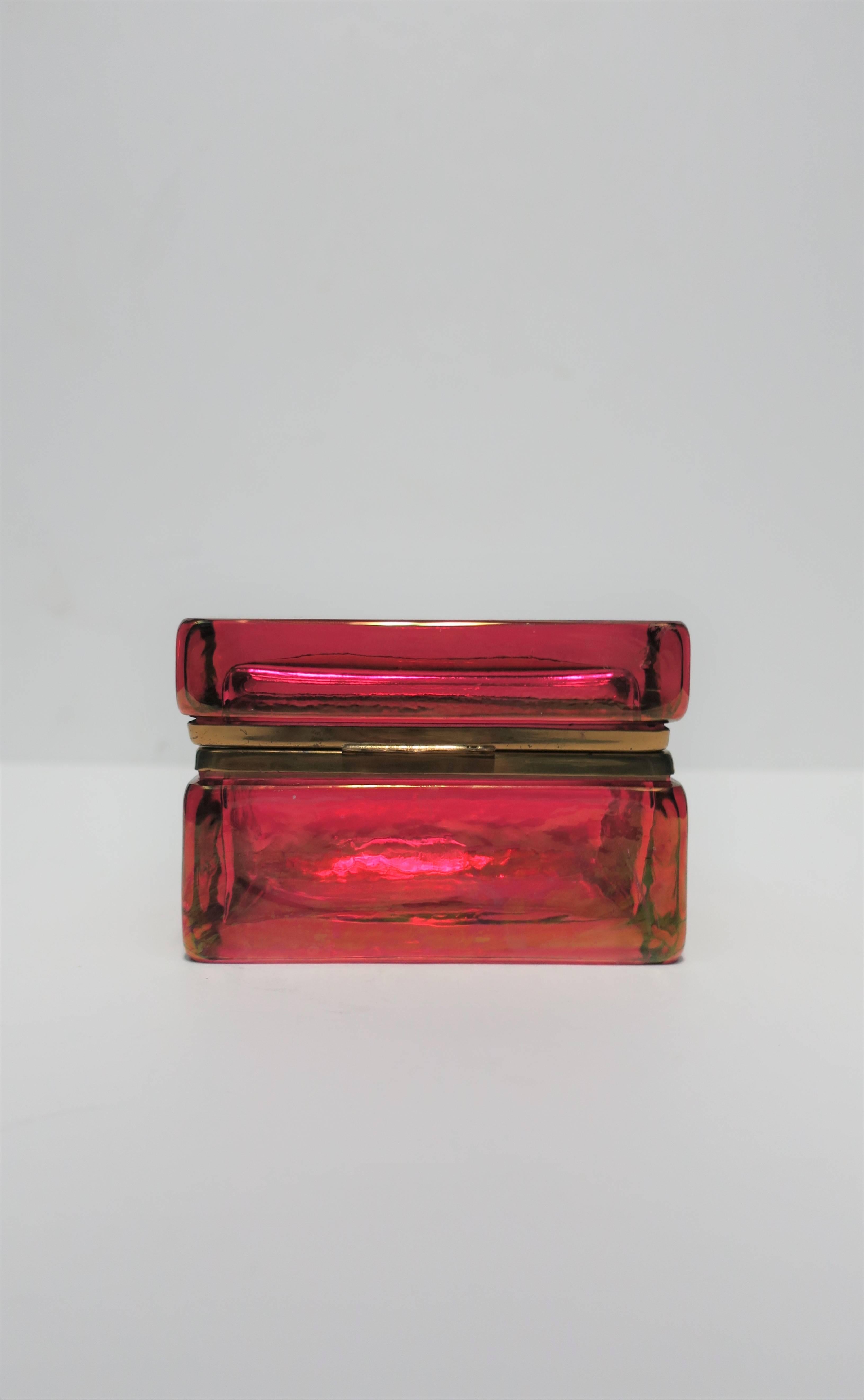 A beautiful and striking Modern Italian red art glass, with brass hinge, jewelry or vanity box, circa early 20th century, Italy.

Box measures: 3.5 in. H x 5.25 W x 3.25 D. 

Item available here online. By request, item can be made available by