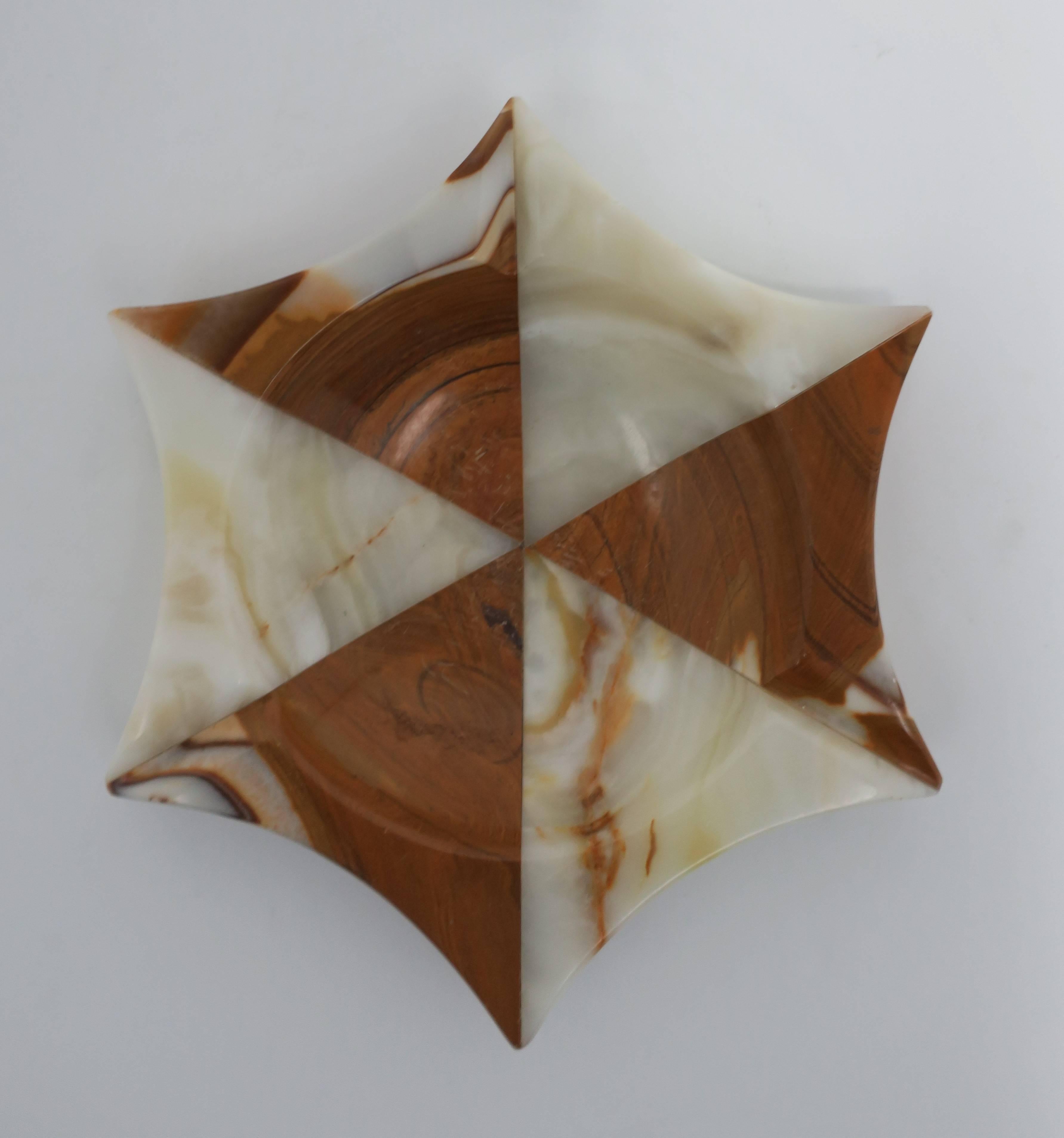 A substantial midcentury modern star shaped polished onyx catch-all vessel, bowl, or ashtray, circa 1960s-1970s. Colors include: white, cream and brown. 

Piece measures: 8.25 in. diameter. 

 