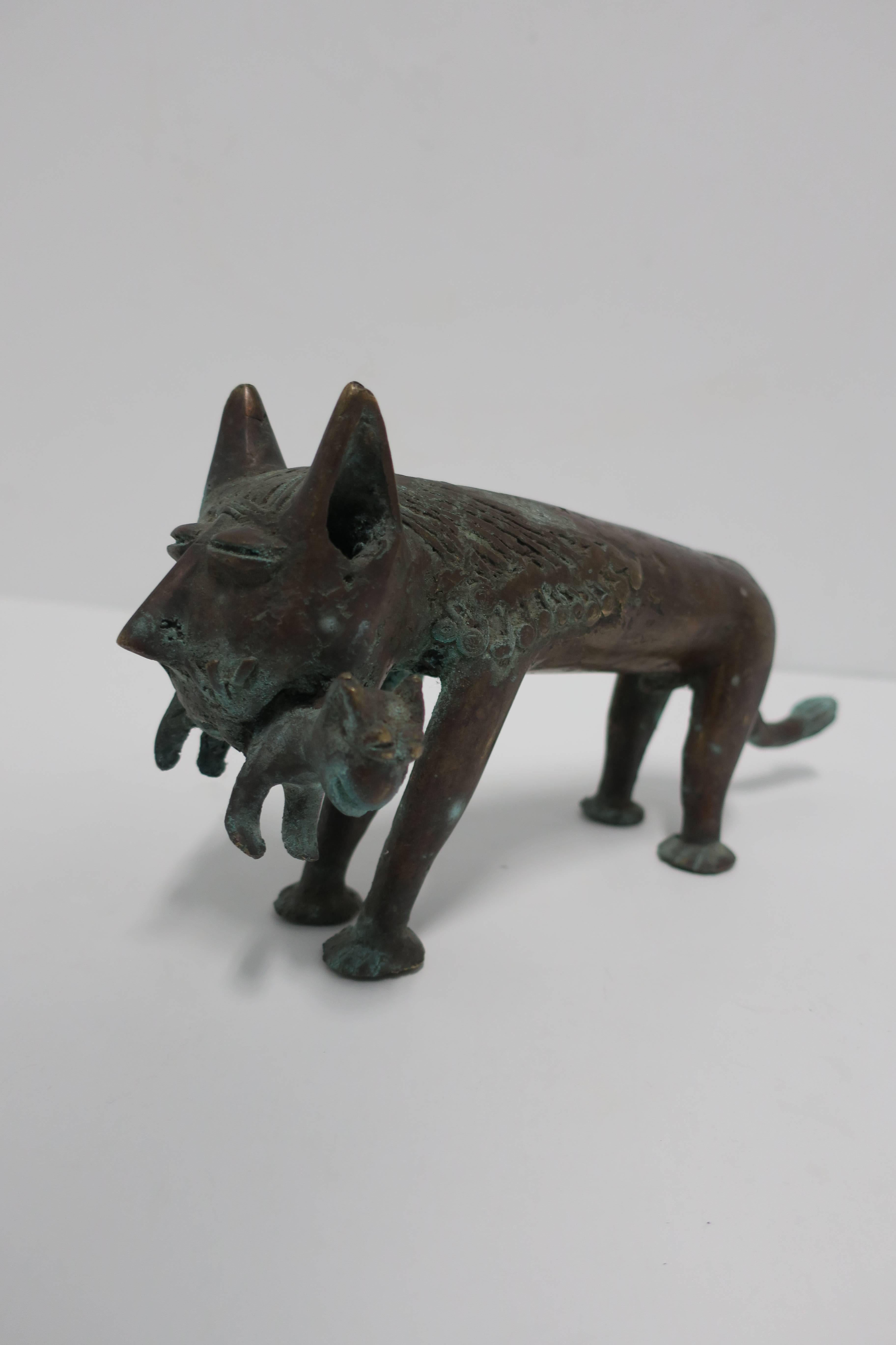 A very substantial and unique modern cat sculpture in solid bronze. Sculpture depicts cat carrying baby cat/kitten. 

Piece measures: 4.25
