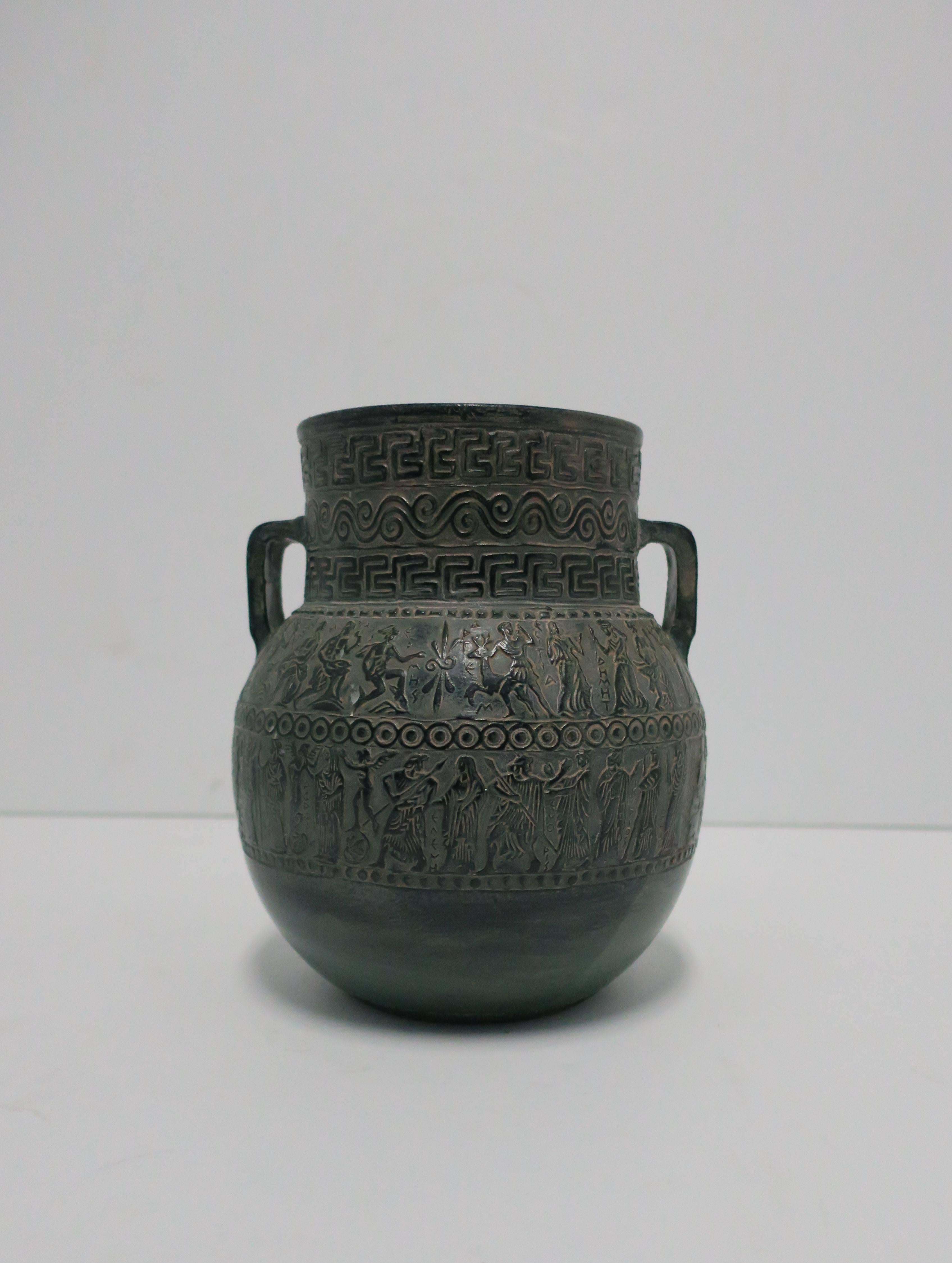 Beautiful vintage dark green pottery vase with raised figural relief design and loop handles. Handmade in Greece as show in image #10. 

Vase measures: 8.25 in. H x 6.50 diameter. 


Item available here online. By request, item can be made