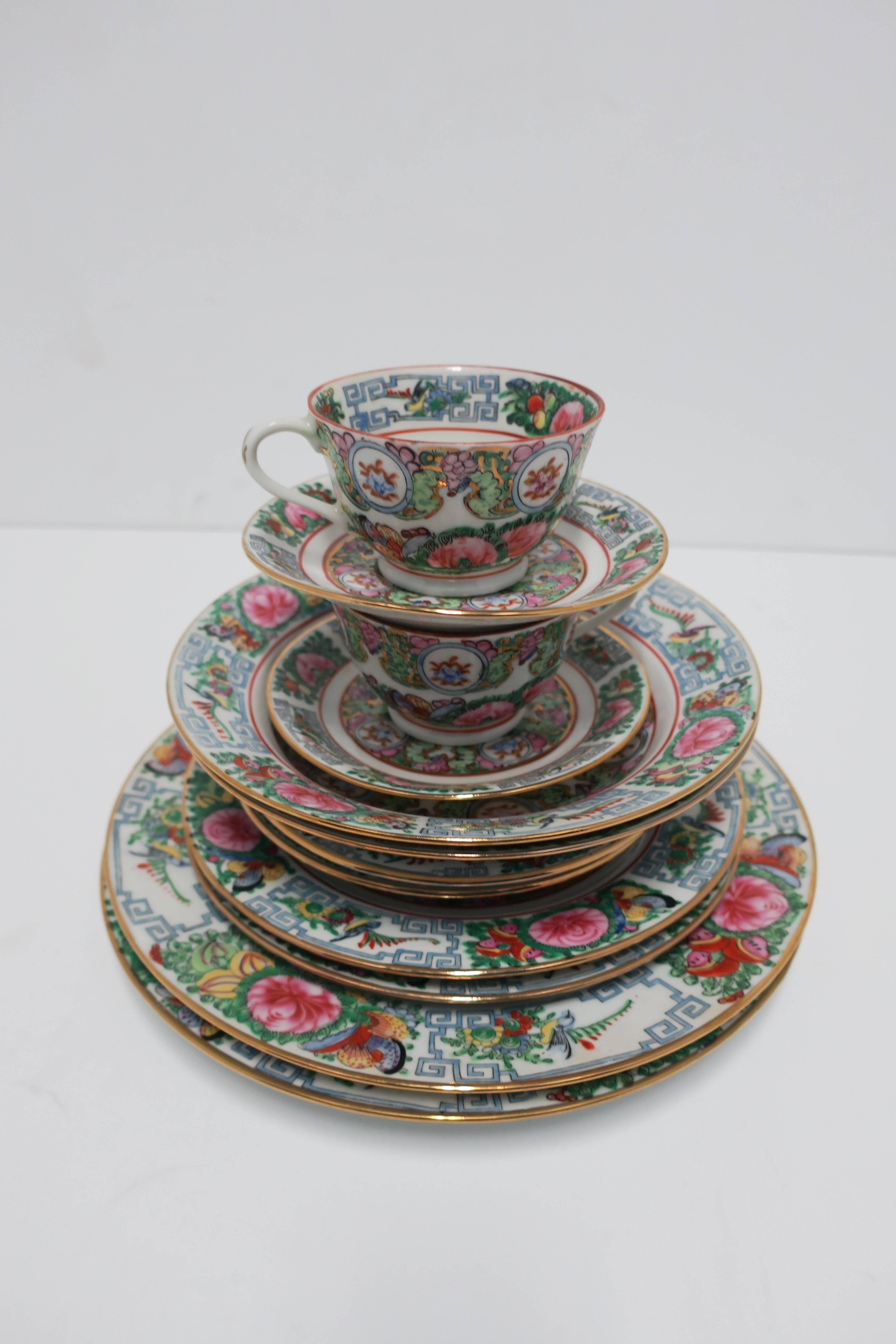 Gorgeous vintage Famille Rose hand-decorated porcelain dinnerware sets, circa mid-20th century. This set of 12 pieces make up two (2) sets, which include tea/coffee cup and saucer. Pieces come with original boxes (3 boxes) marked Villeroy & Boch,