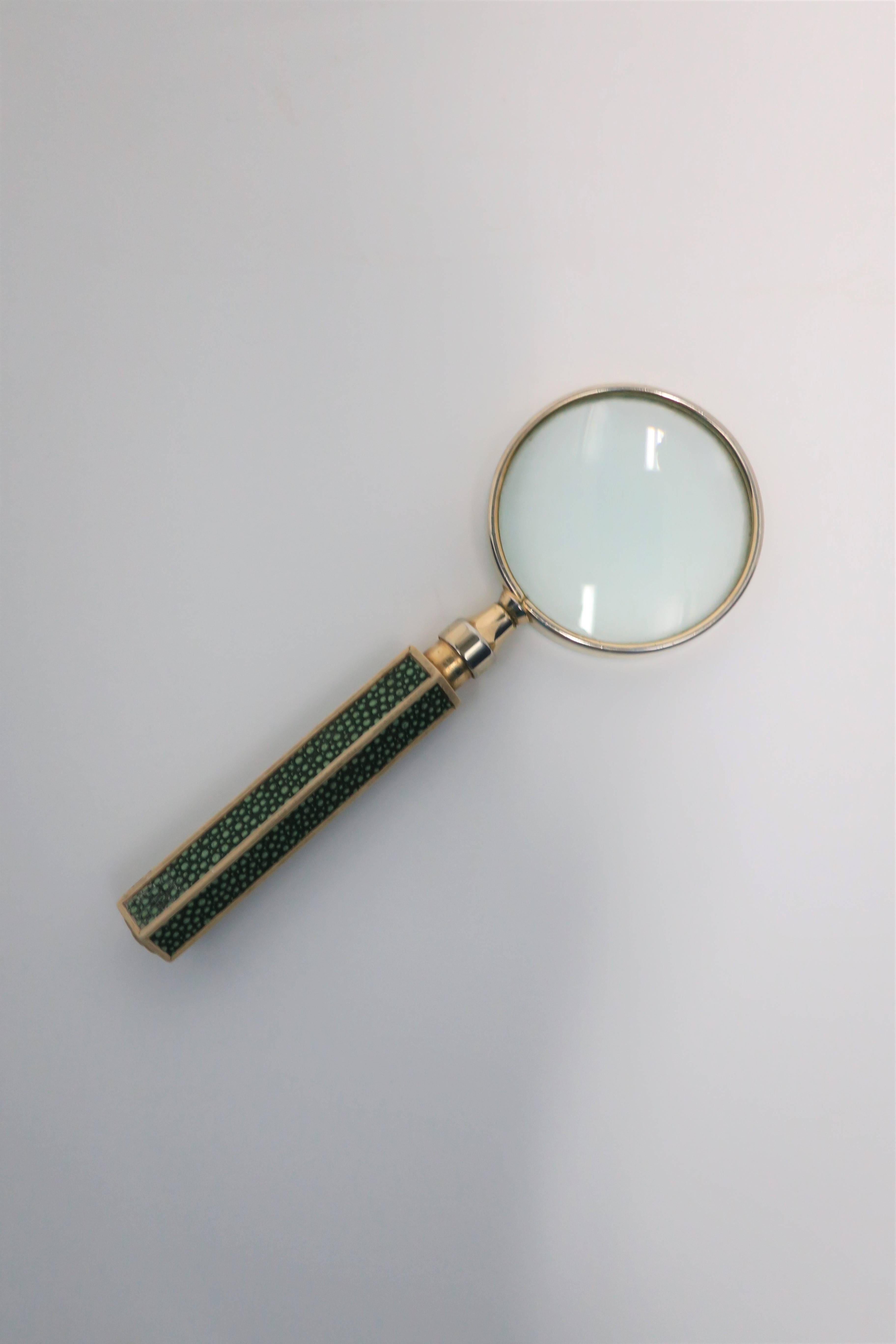 A vintage Modern style magnifying glass with two-tone metal and green shagreen-esque (faux) handle design, in the style of designer Karl Springer. A great desk accessory. 

