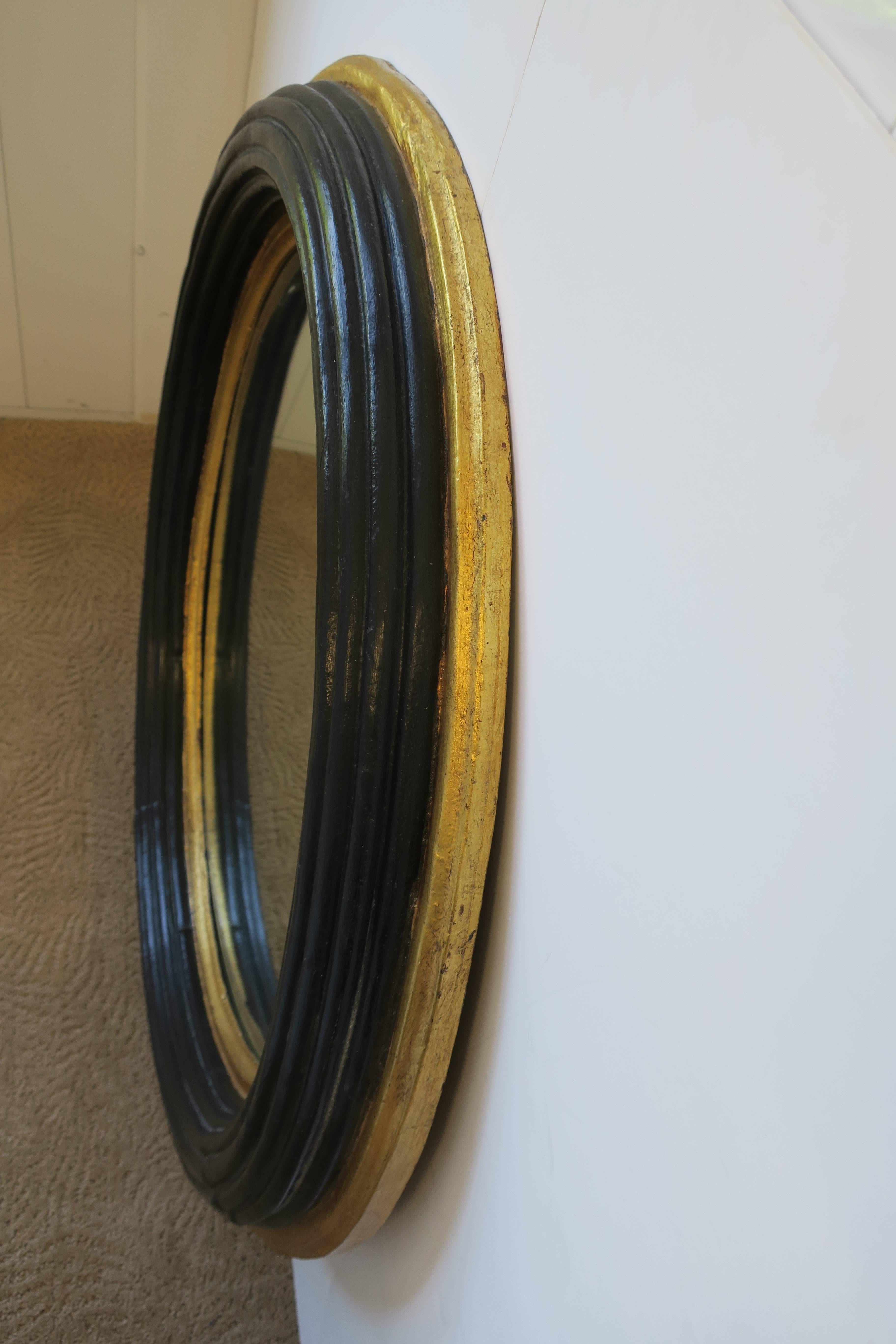Gilt Midcentury Round Black and Gold Beveled Wall Mirror