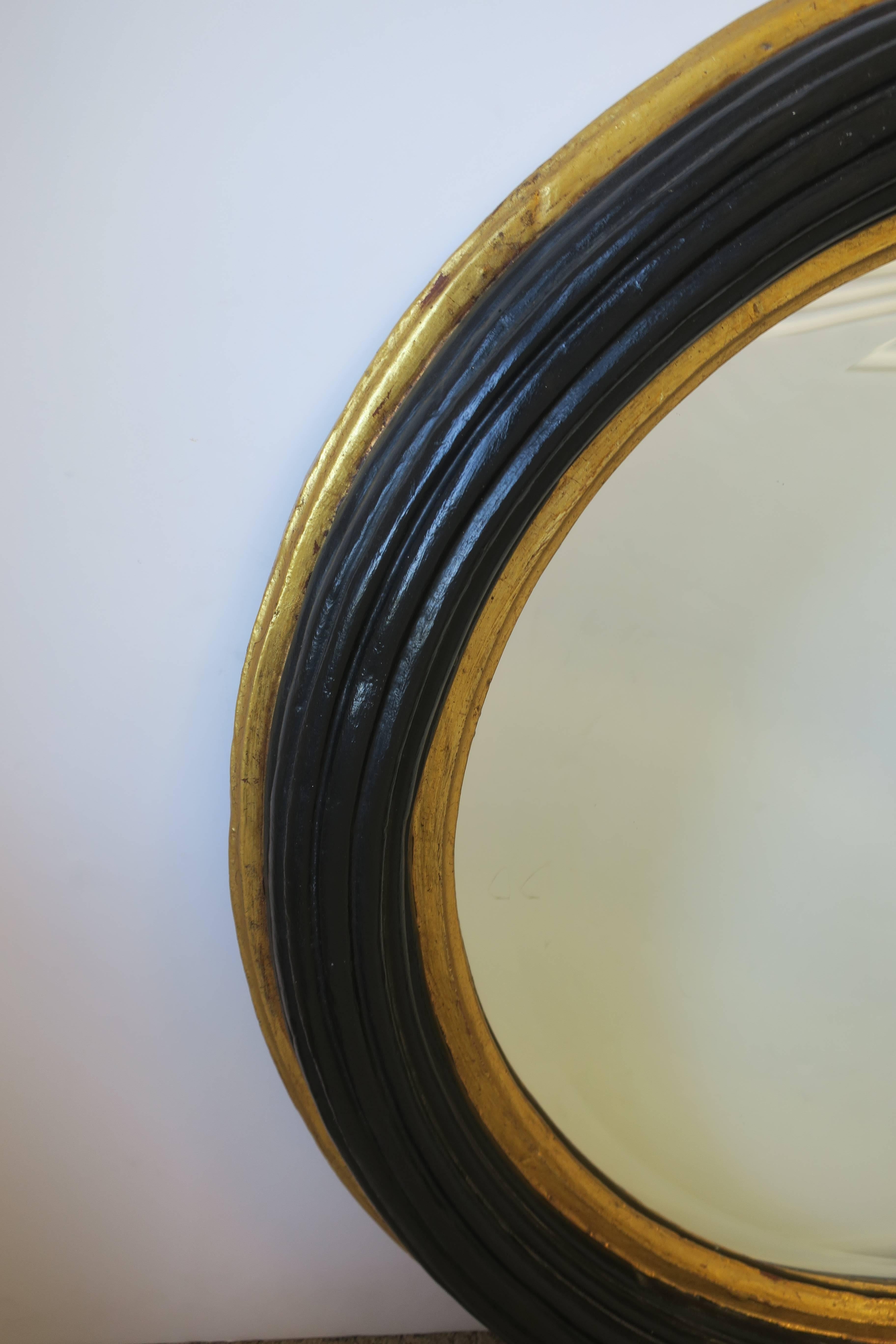20th Century Midcentury Round Black and Gold Beveled Wall Mirror