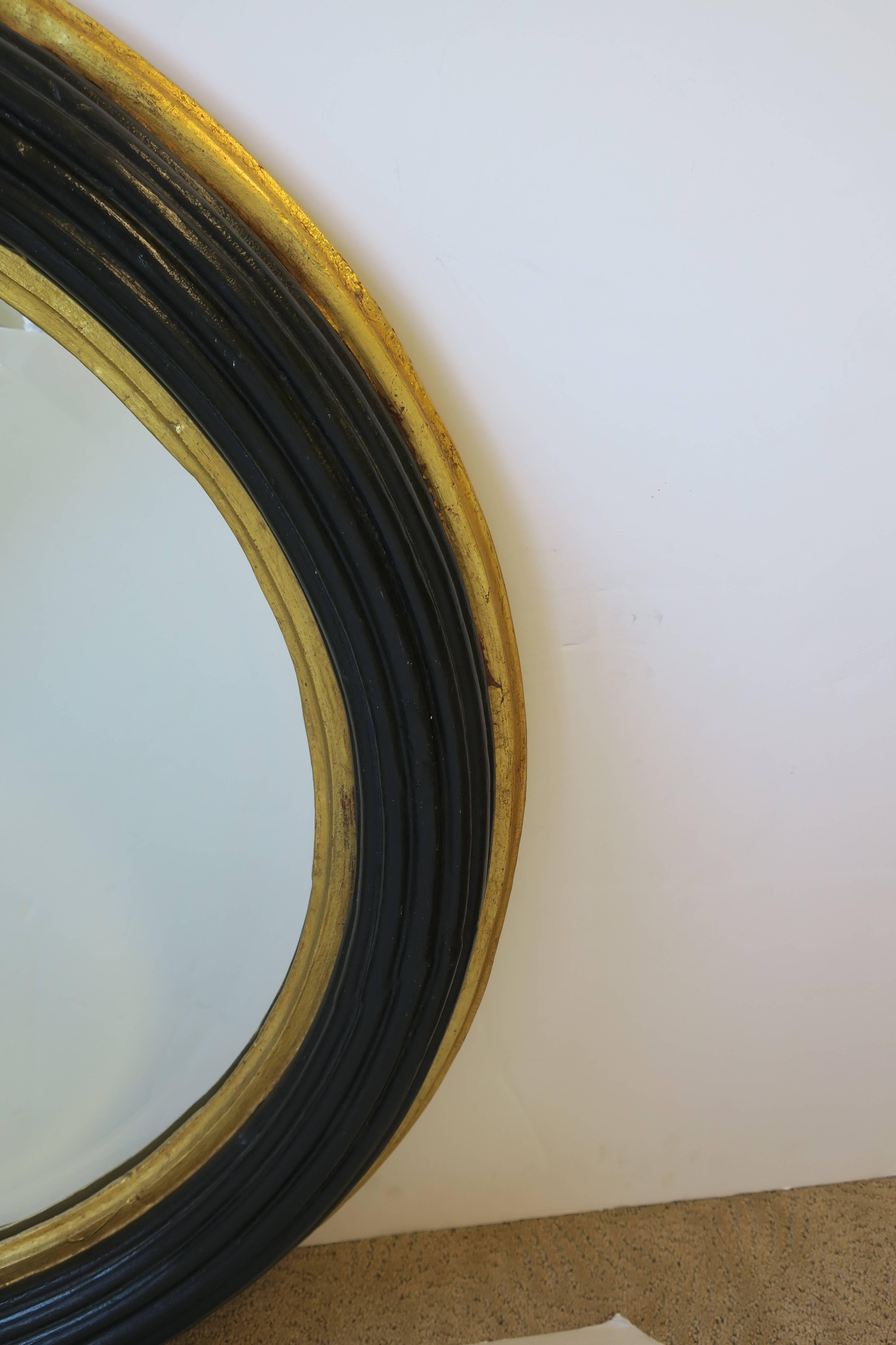 Midcentury Round Black and Gold Beveled Wall Mirror 1